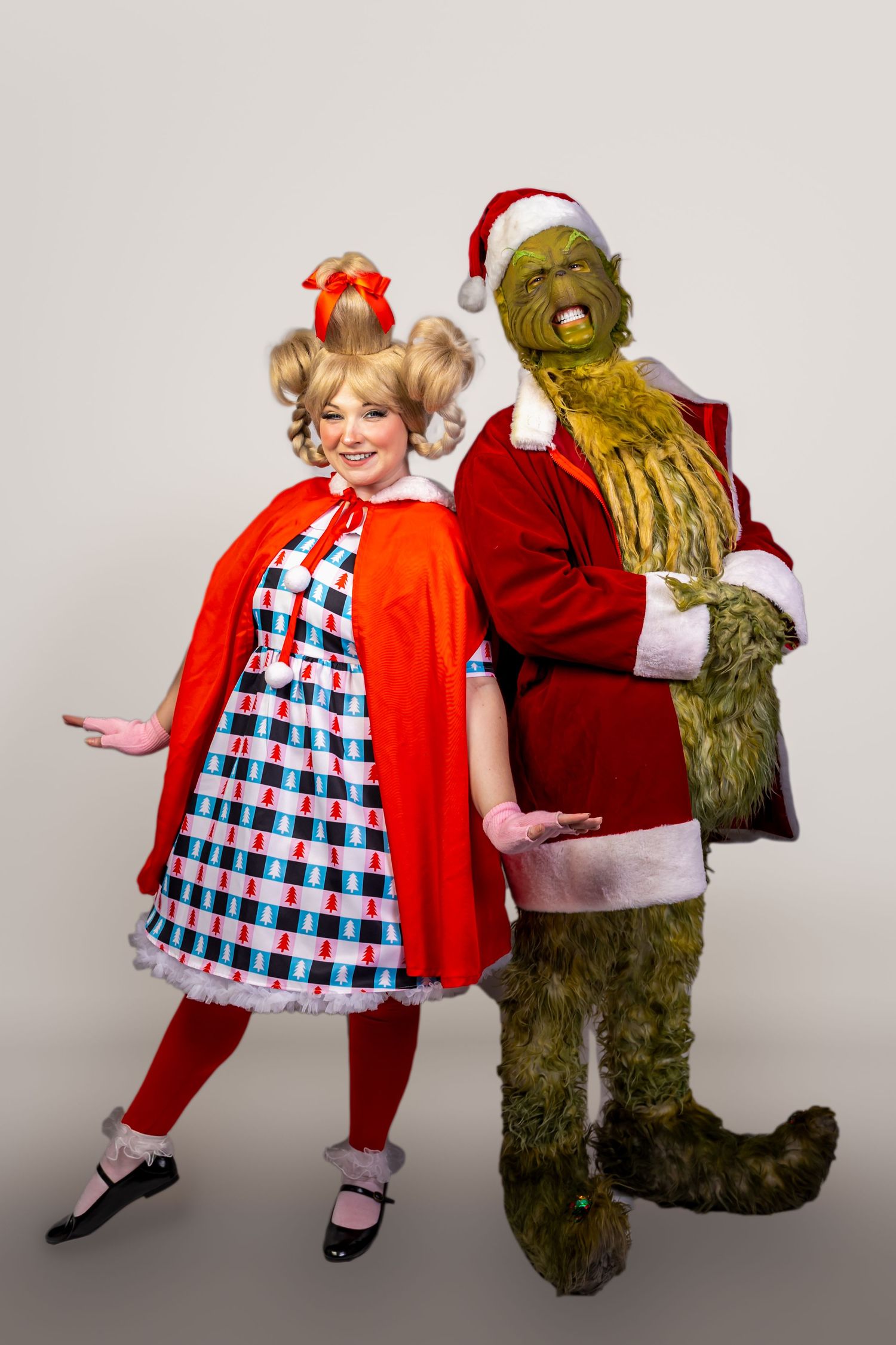 A series of photos showing someone in a red cape and checkered dress dancing with a large stuffed bear character.
