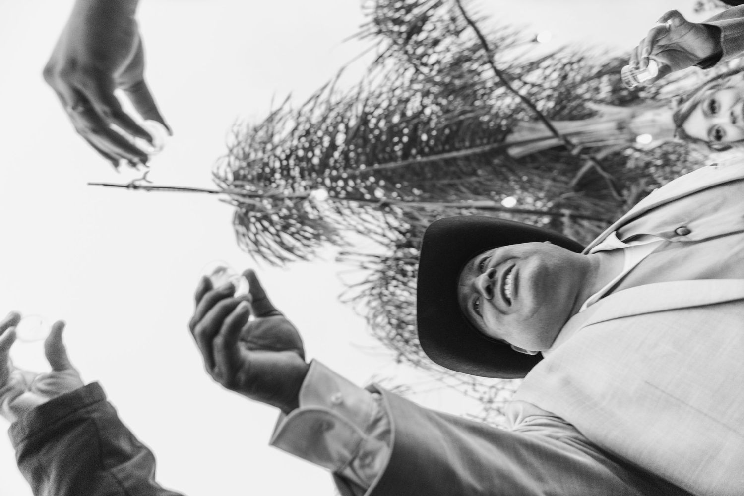 Dynamic black and white candid shots capture quince party members in motion during celebration in San Jacinto.