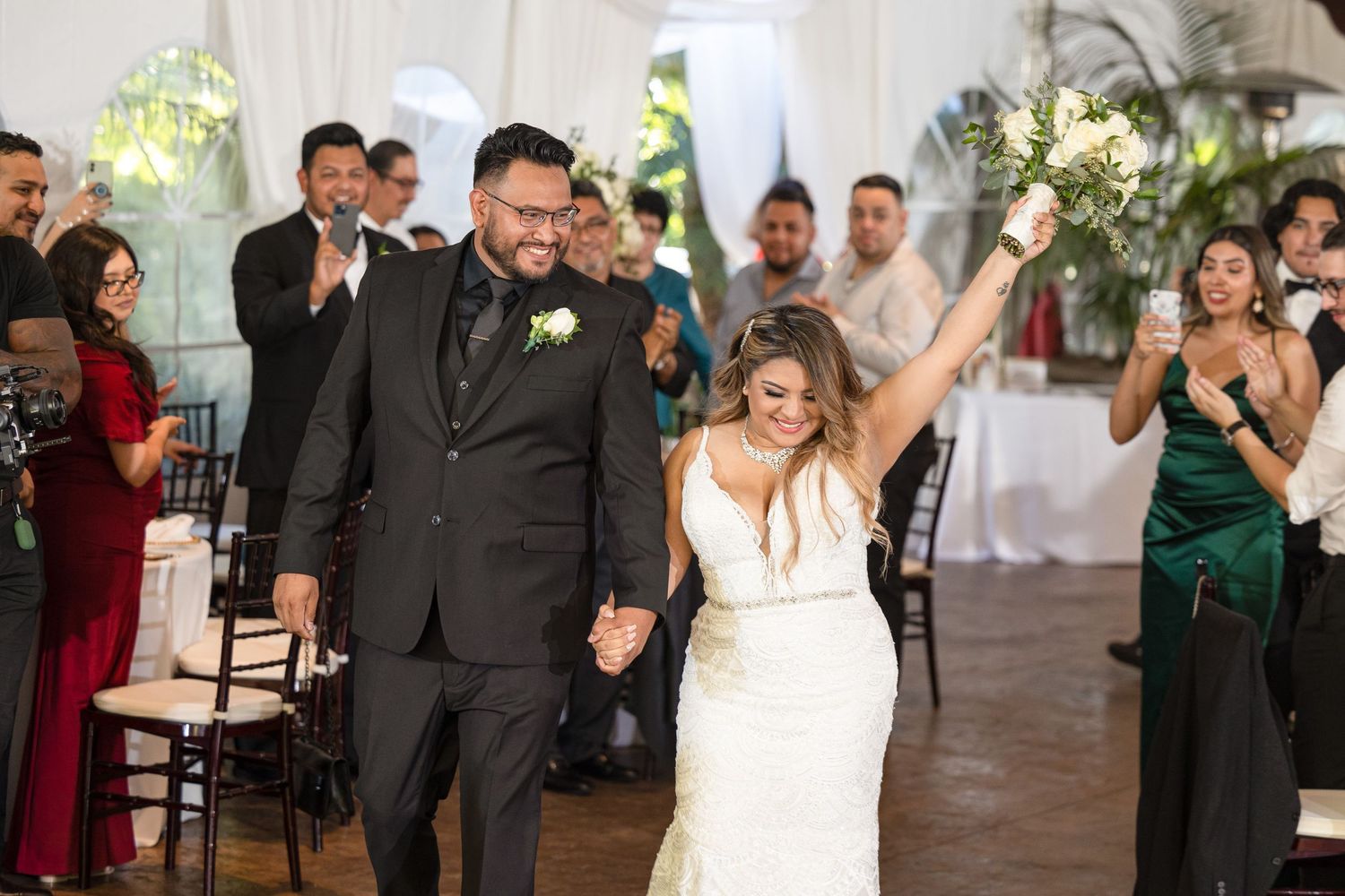 Wedding reception photos capturing candid moments of dancing and celebration in a white tent.