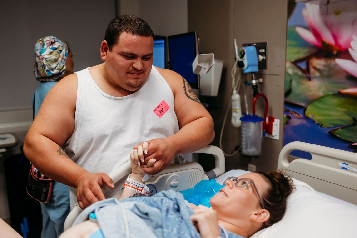 Hospital staff provide patient care while monitoring medical equipment.
