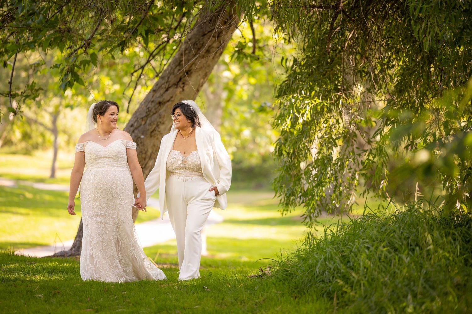 Garden wedding setting with beautiful trees creating natural shade and ambiance.