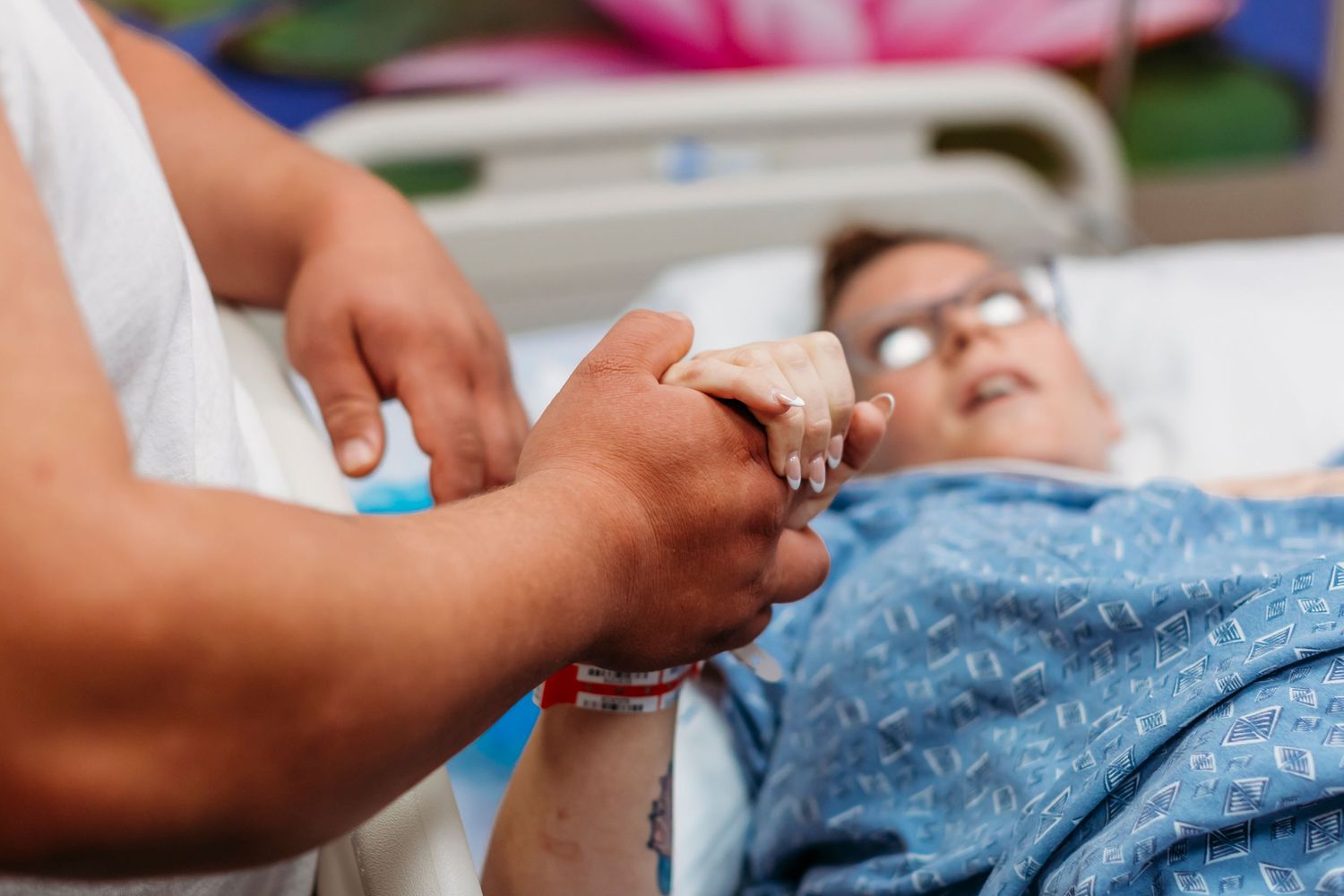 Healthcare workers perform medical procedures in a clinical setting.