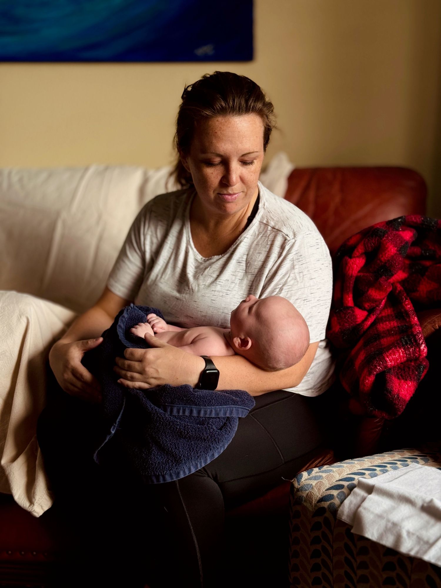 Hilary comforting Lucca between photos during his in-home newborn session.