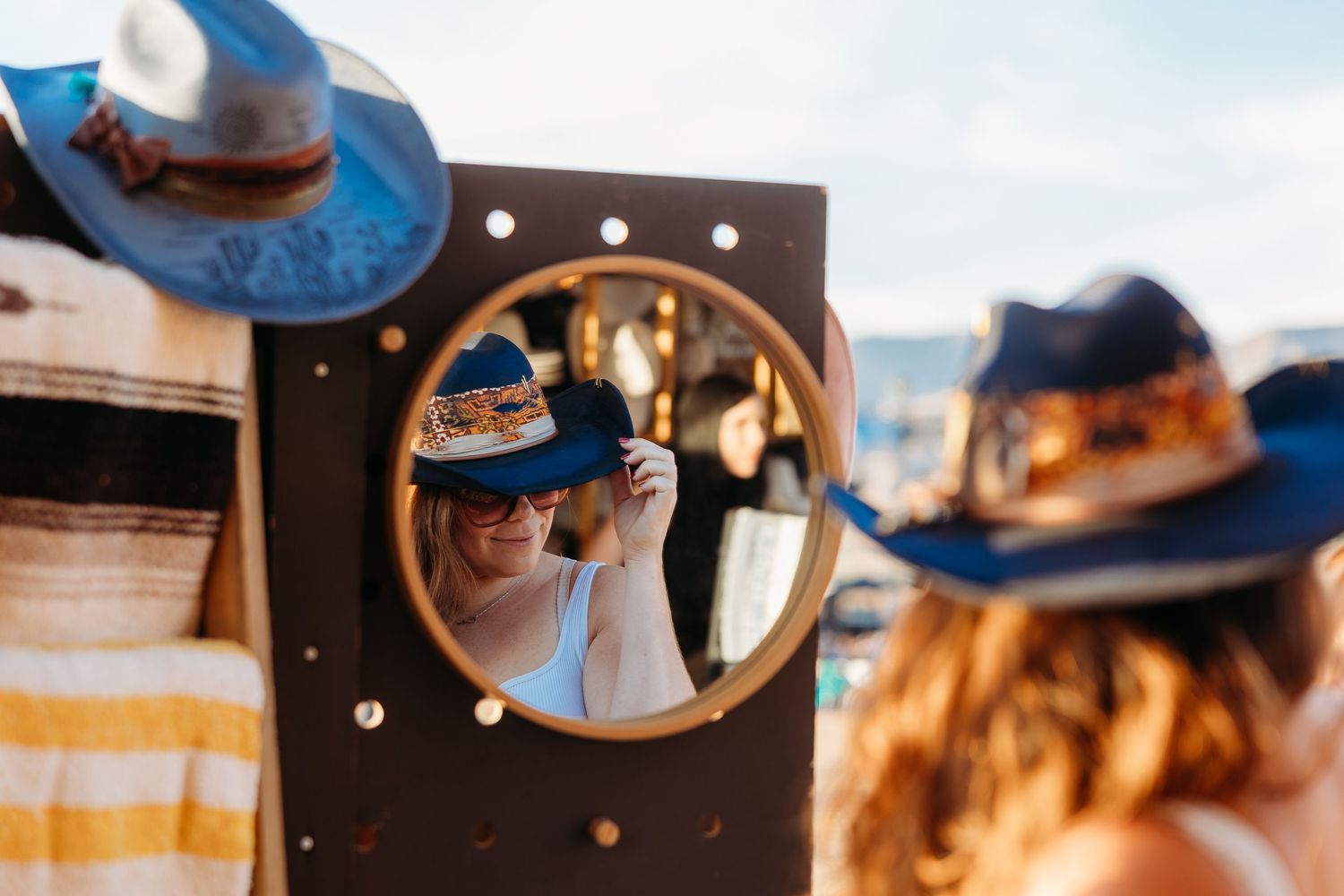 Series of abstract mirror reflections with blue sky and sunlight.