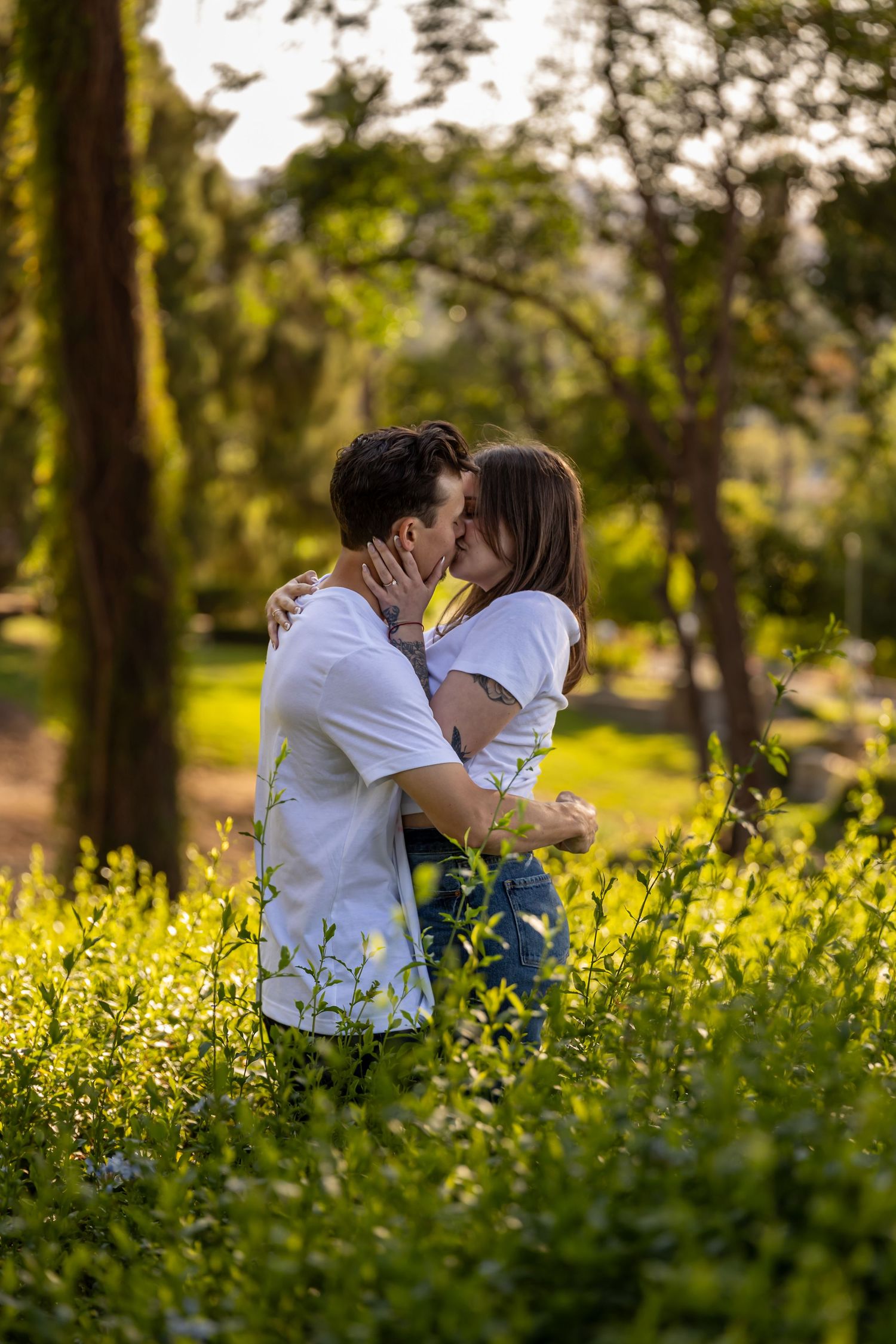 Romantic scene in a field of yellow wildflowers during golden hour.