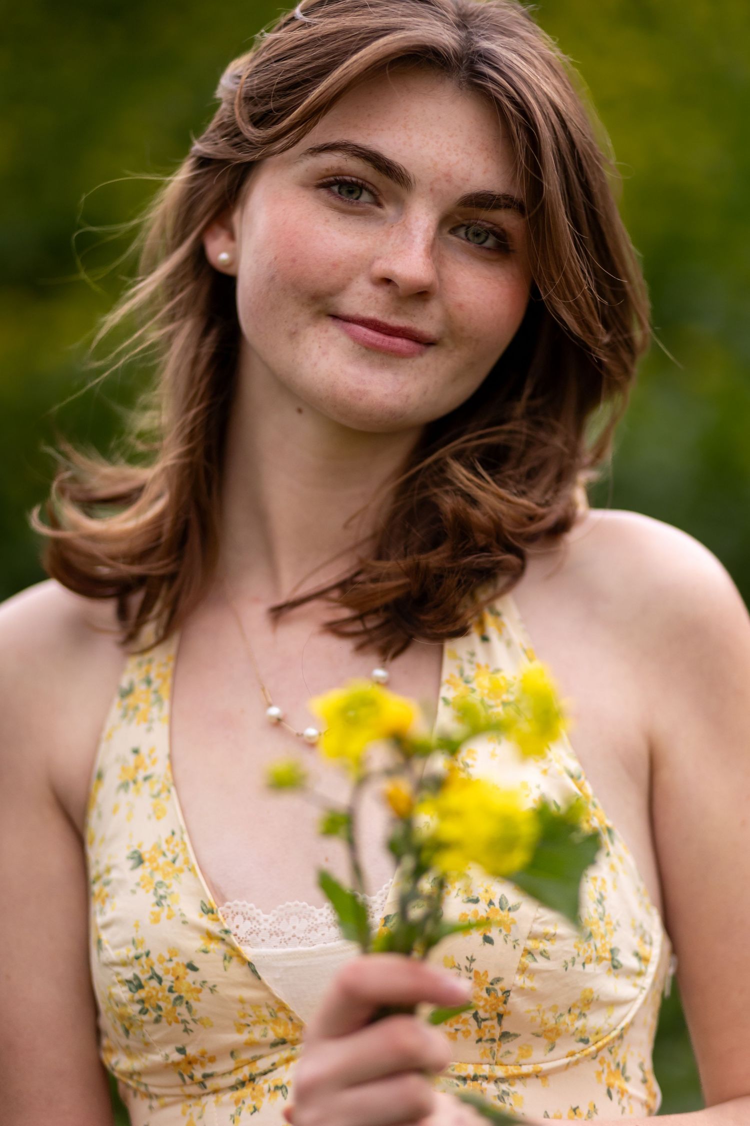 Portrait with yellow wildflowers against green natural background in Redlands.