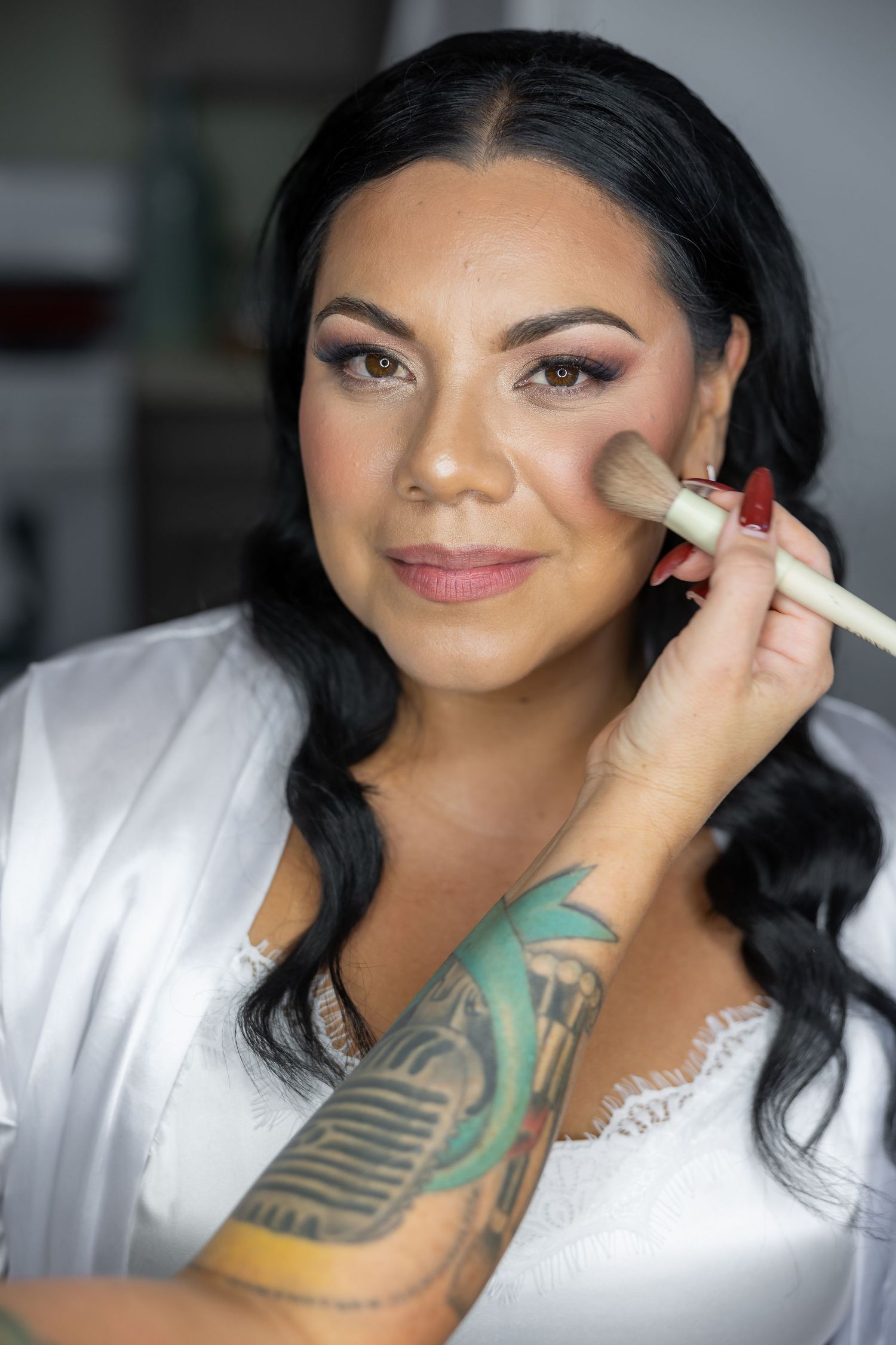 Getting ready sequence showing makeup application with professional brushes.