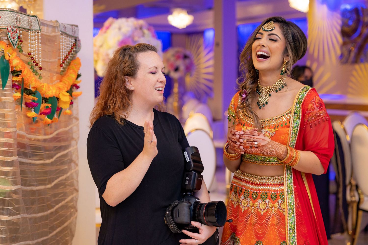 Hilary and beautiful bride, Divneet, sharing a laugh about something during their Mendi