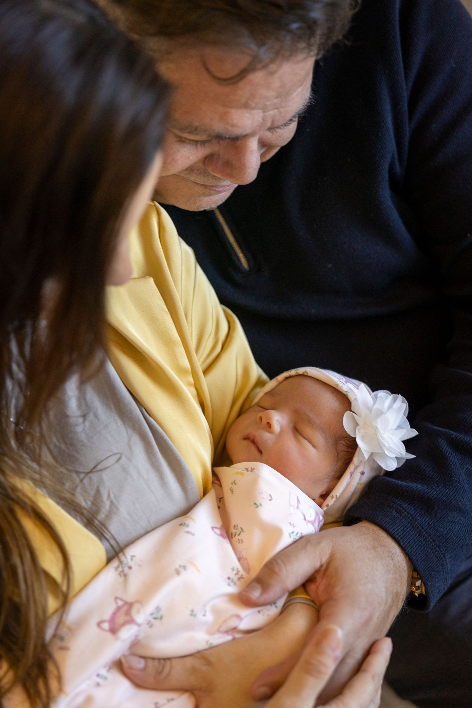 A tender moment of breastfeeding is captured in a sequence of photos showing parent and infant bonding.