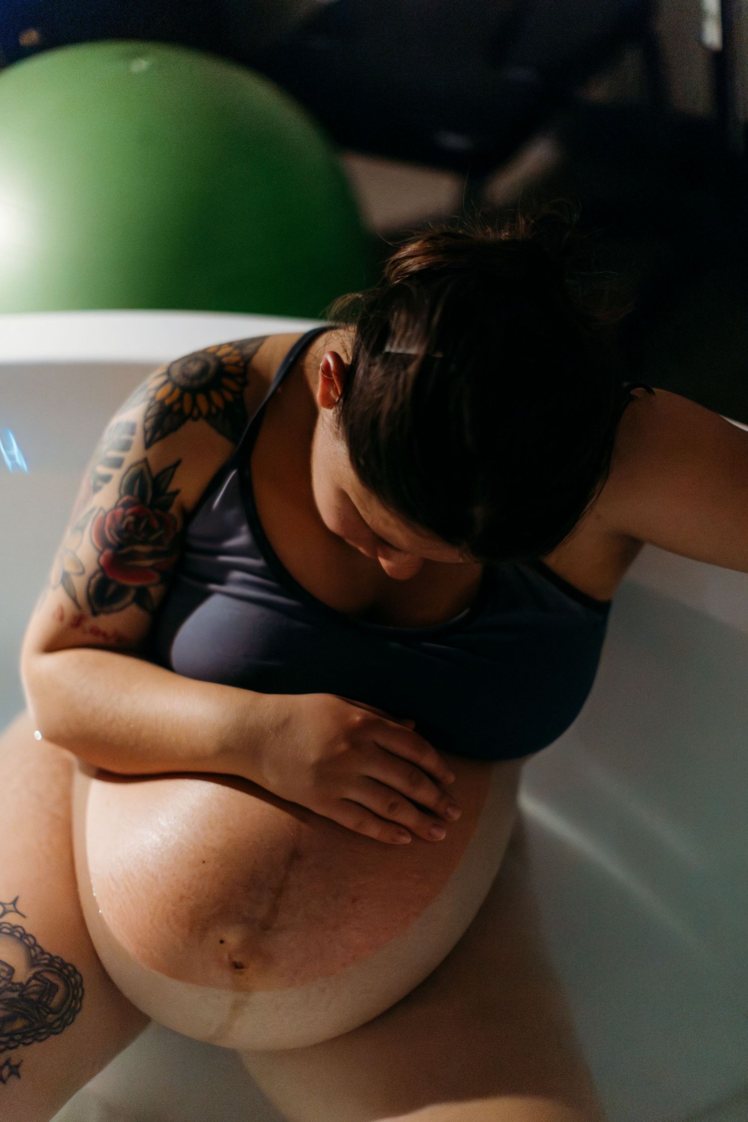 Candid shots showing a pregnant person's belly with visible tattoos in natural lighting.