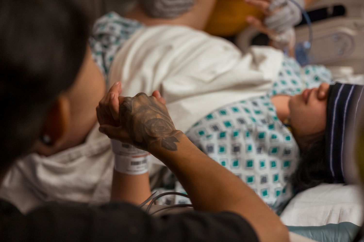 Hospital room scene showing medical care and support during labor.