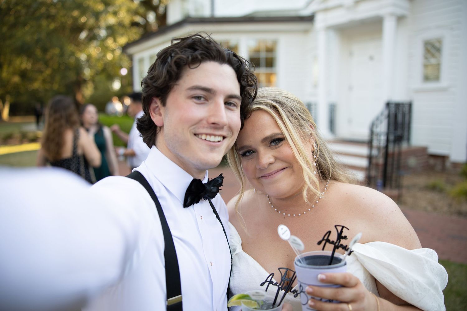 A bride and groom share a sweet moment together during their wedding photo session outdoors.