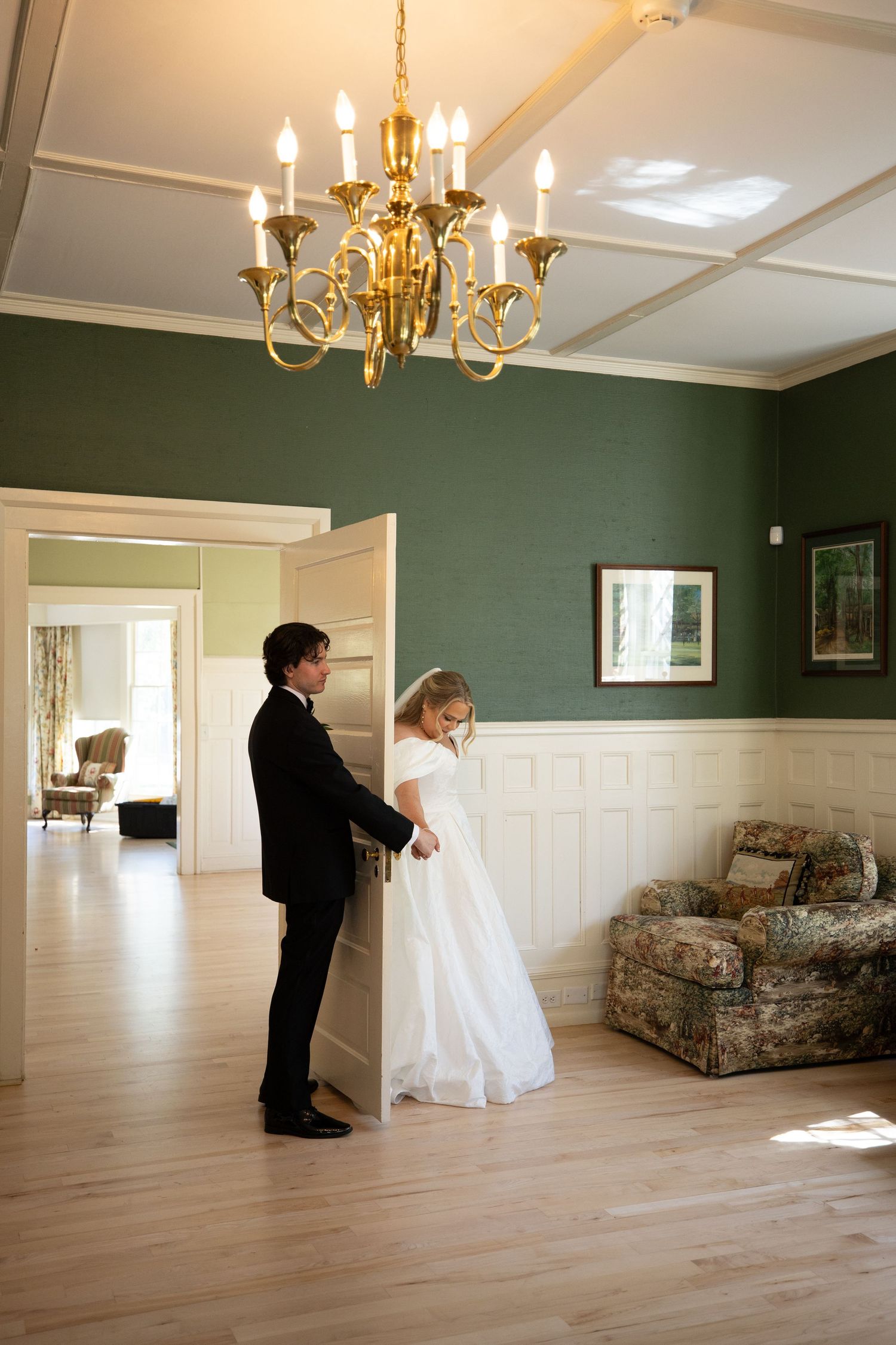 A sequence of wedding photos showing a couple dancing in an elegant room with hardwood floors and chandeliers.
