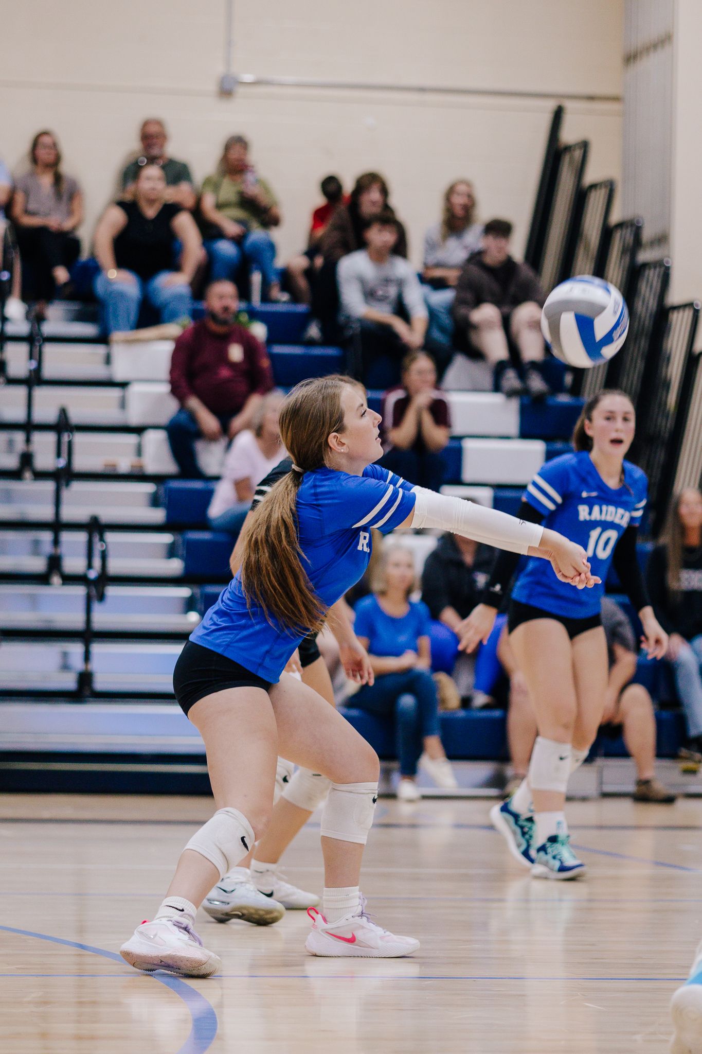 Volleyball playing passing a ball during sports game.