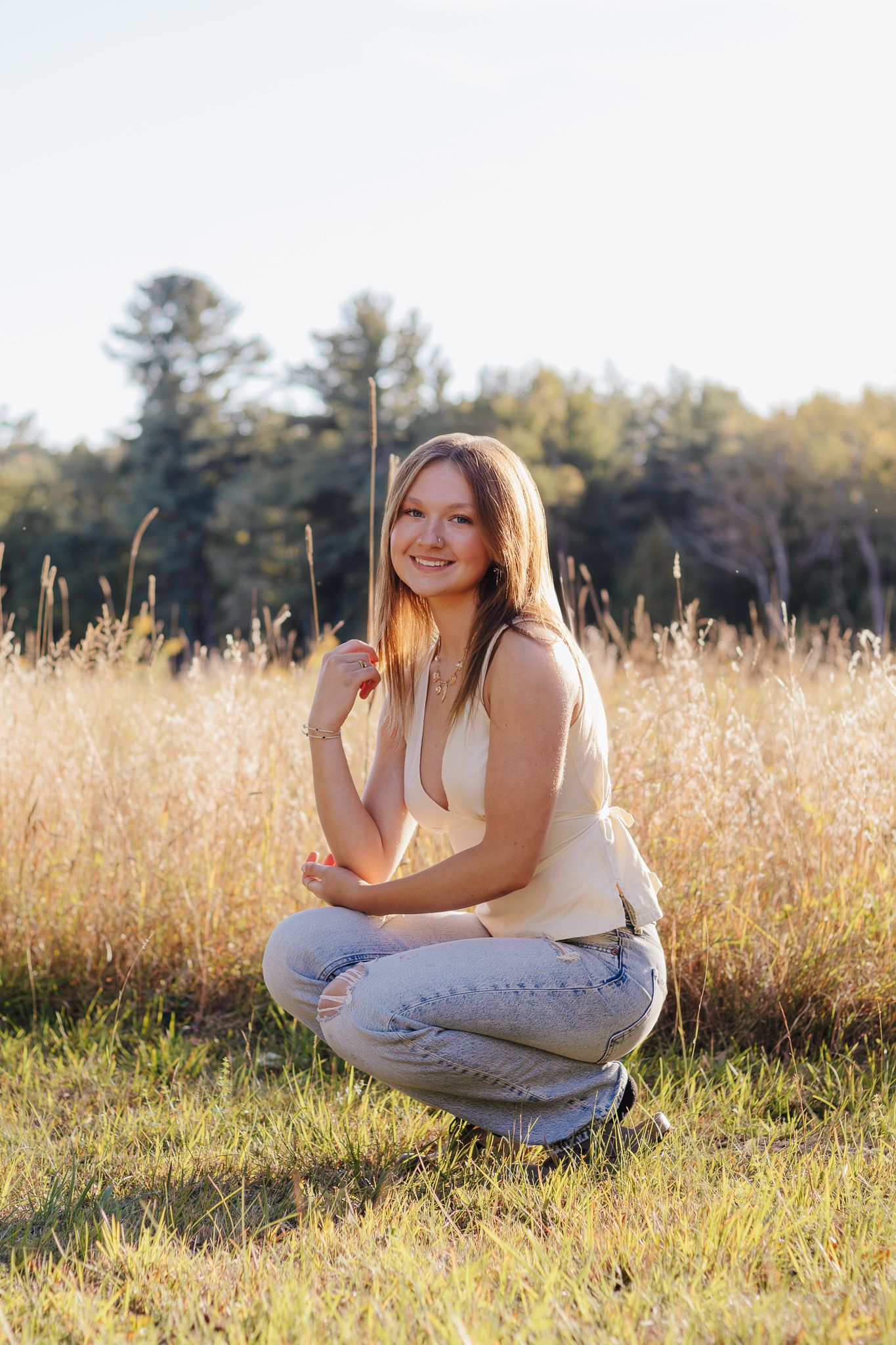 Senior grad portraits in a wheat field.