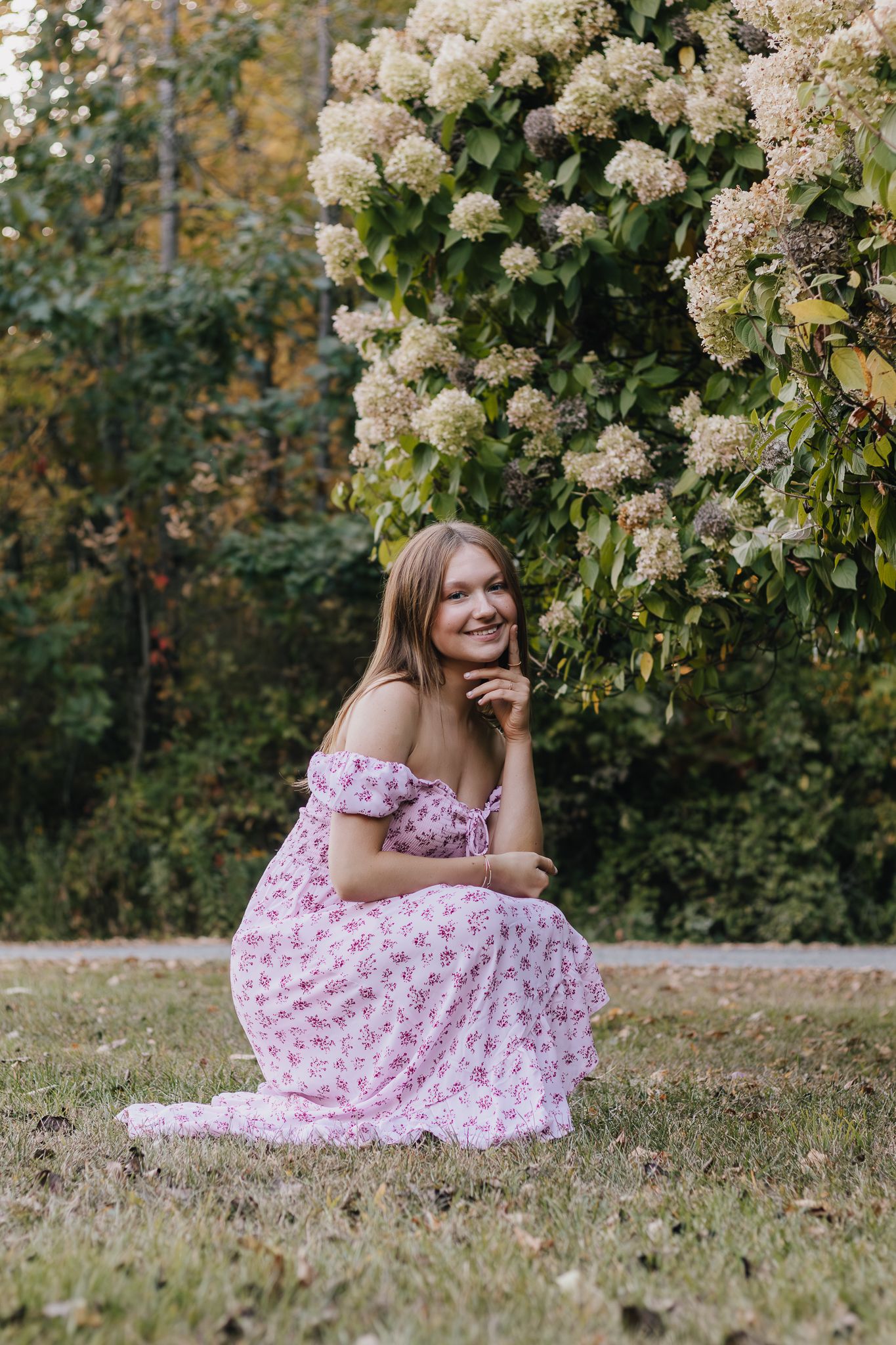 High school senior portrait with flowers.