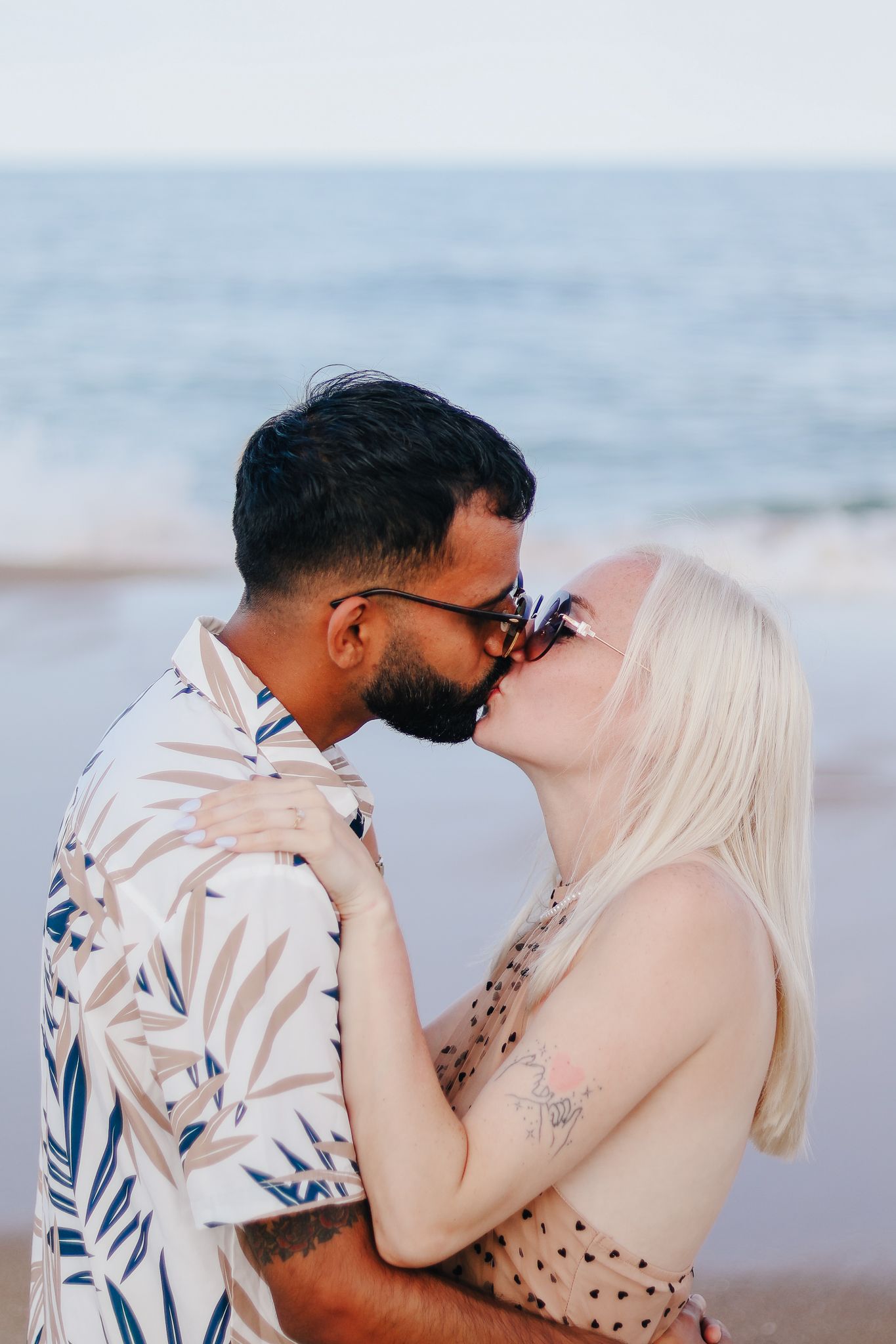 Couple kissing during engagement session.