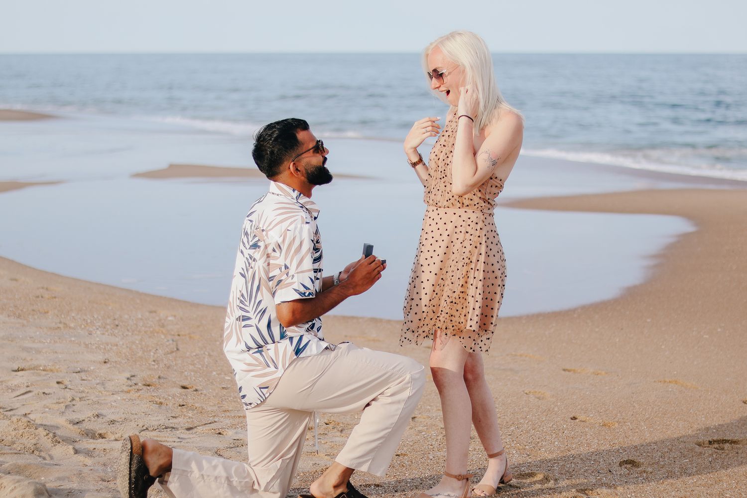 Couple proposing during engagement session.