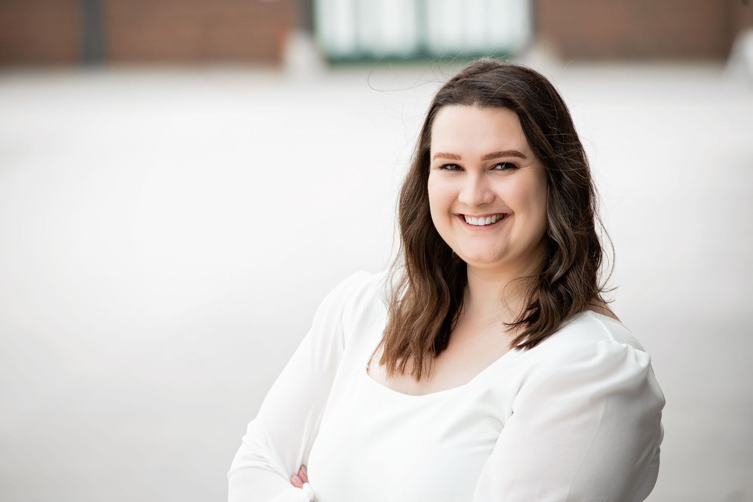 Adult woman smiles for headshot