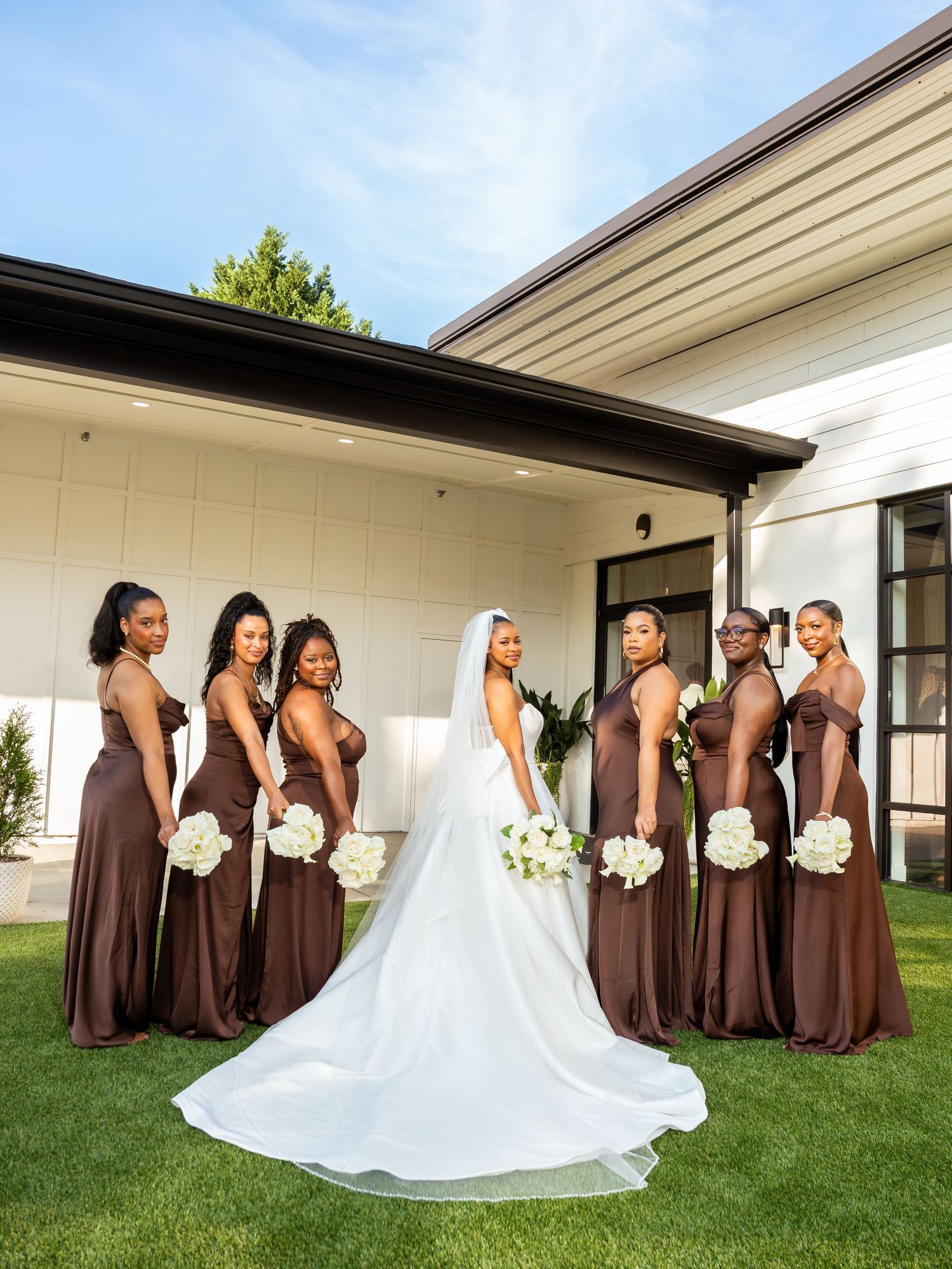 Tamara and her bridesmaids pose outdoors before the wedding.