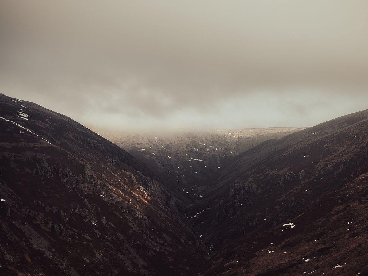 landscape image of moorland crags with incoming cloud