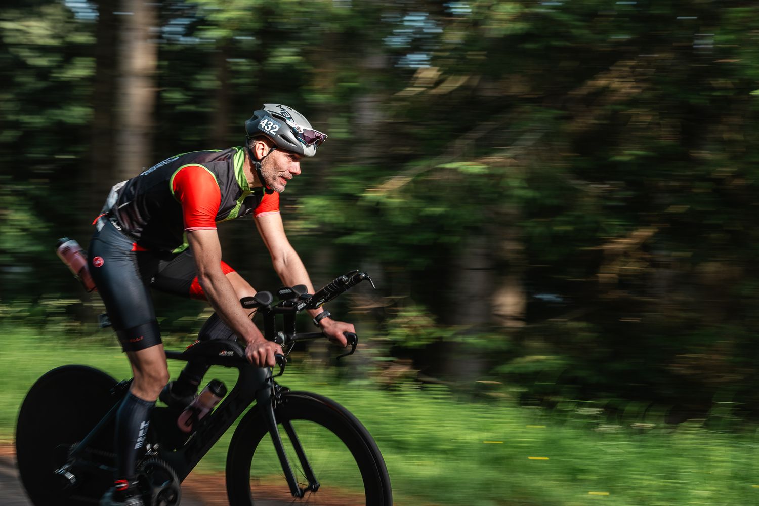 cyclist with shutter drag at the northumbrian triathlon