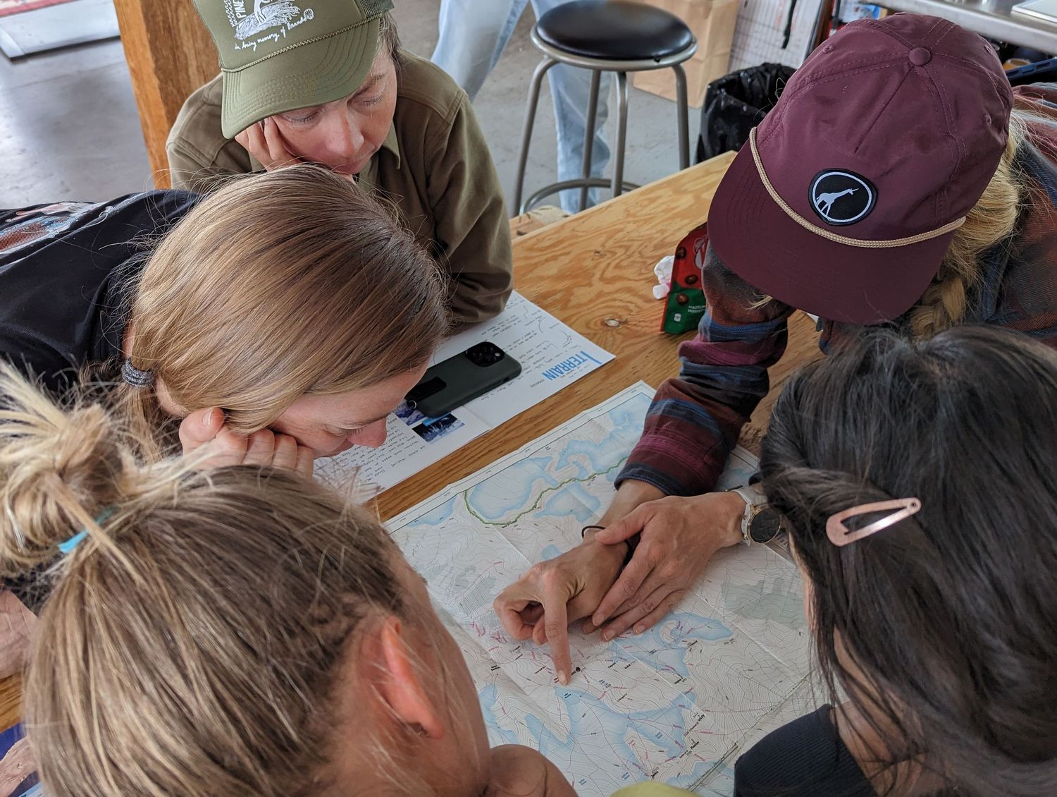 Women overlooking a map