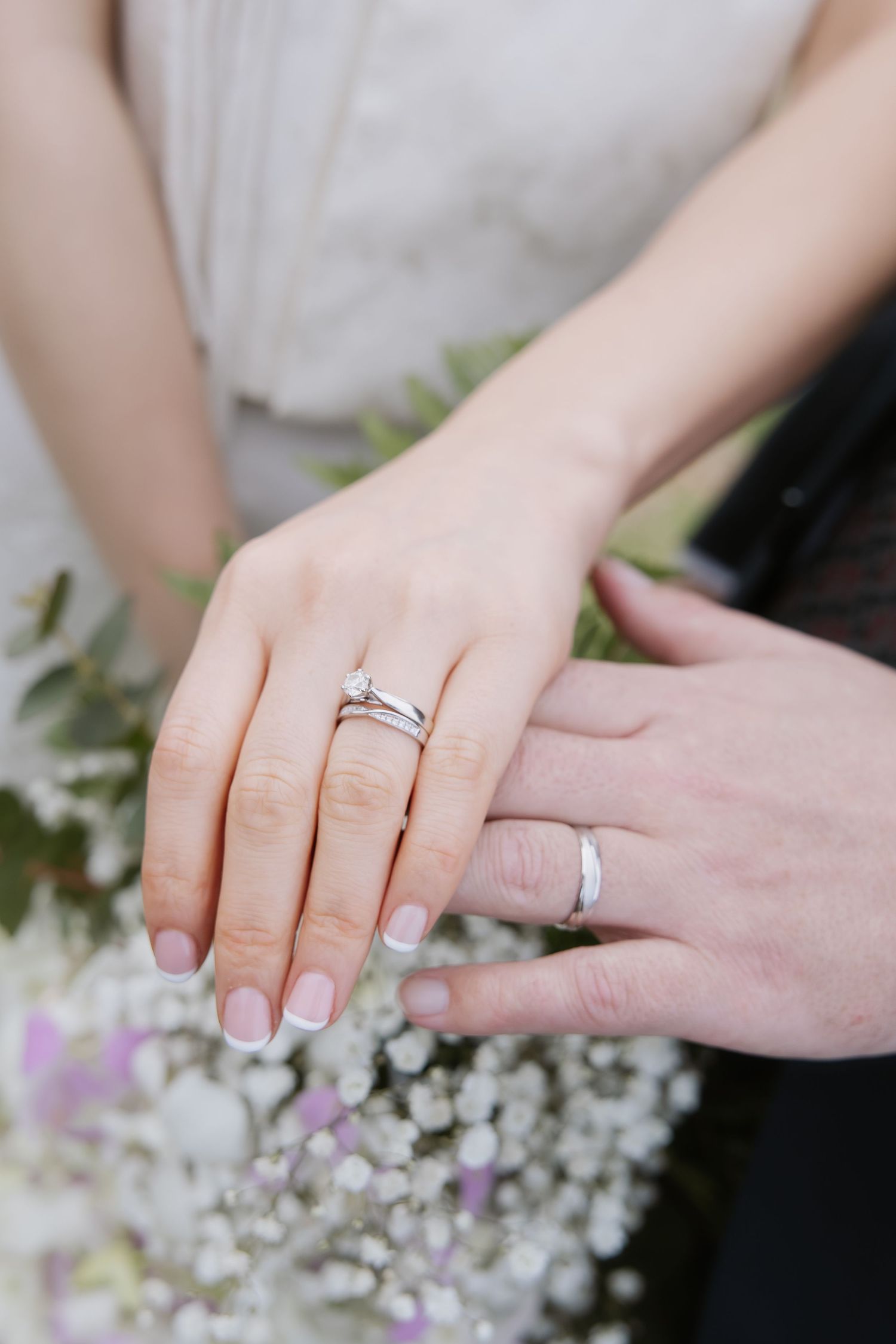 A series of close-up photos showing wedding rings and hands creating a montage of romantic wedding moments.