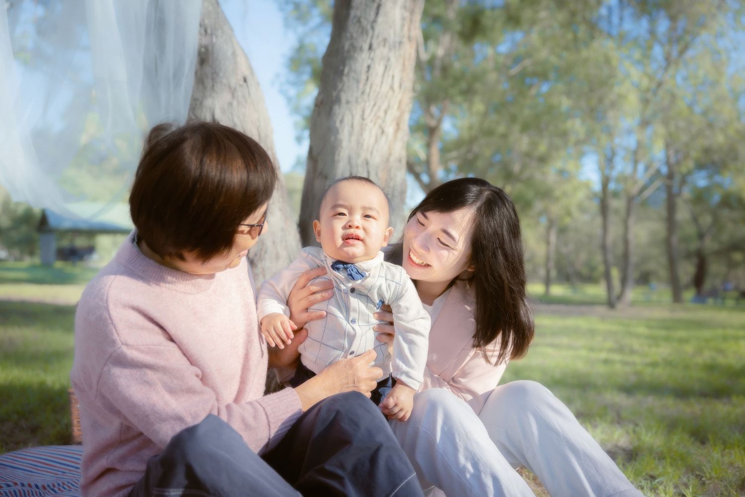 Family spending quality time together outdoors in a park on a sunny spring day.