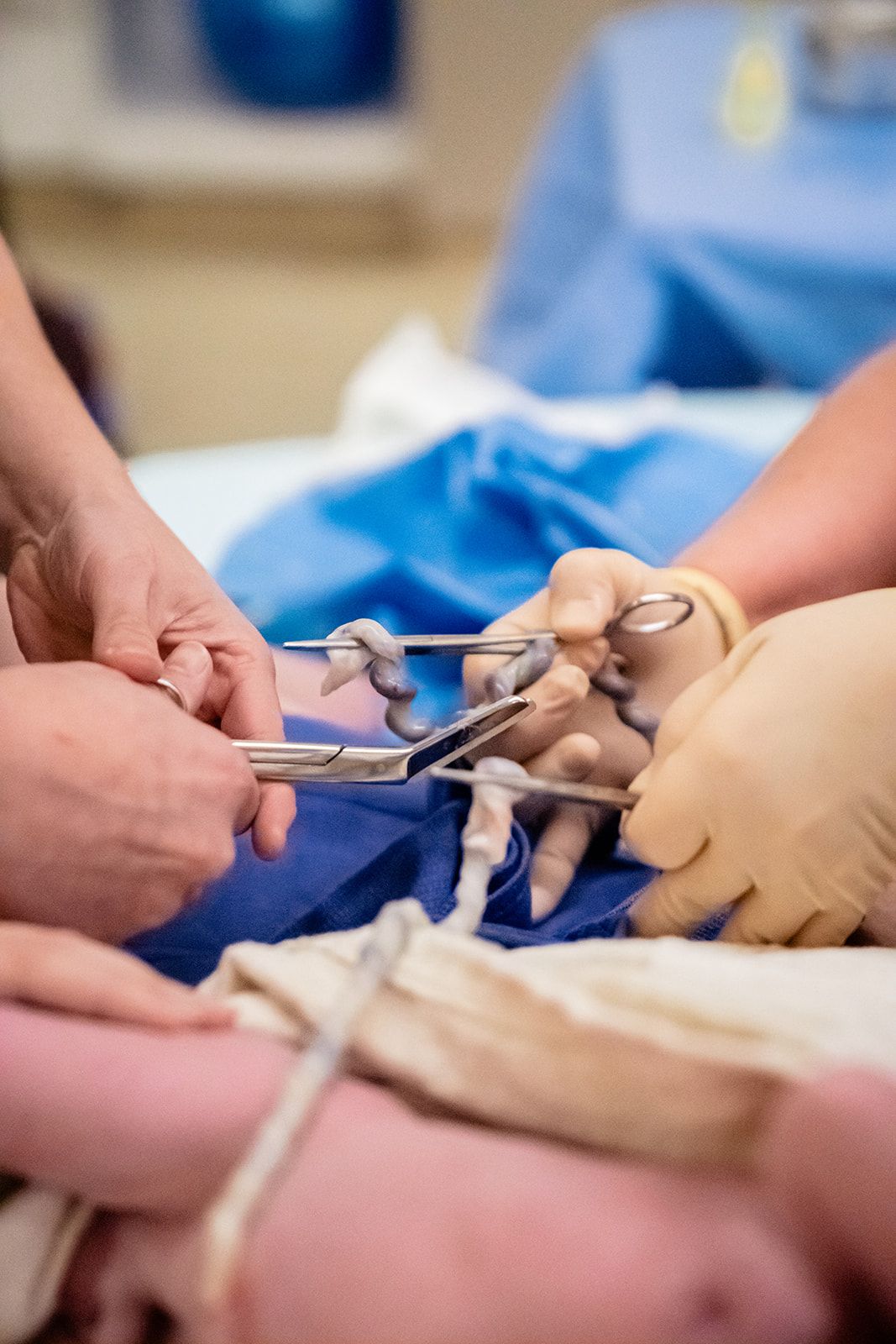 Surgeons using surgical instruments during a medical procedure in an operating room.