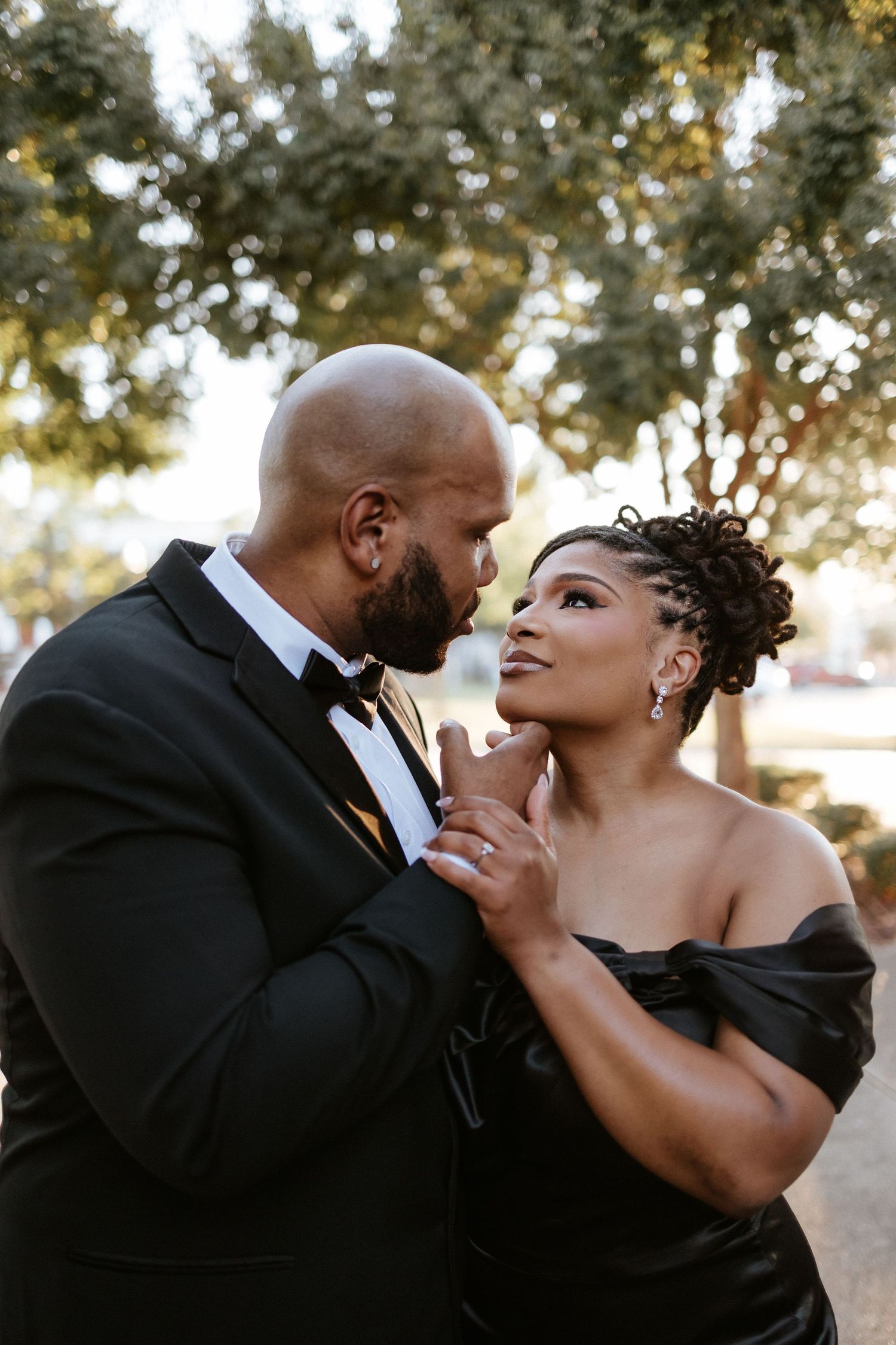 Couple embracing during a romantic elopement session in Opelika, Alabama with candid storytelling photography