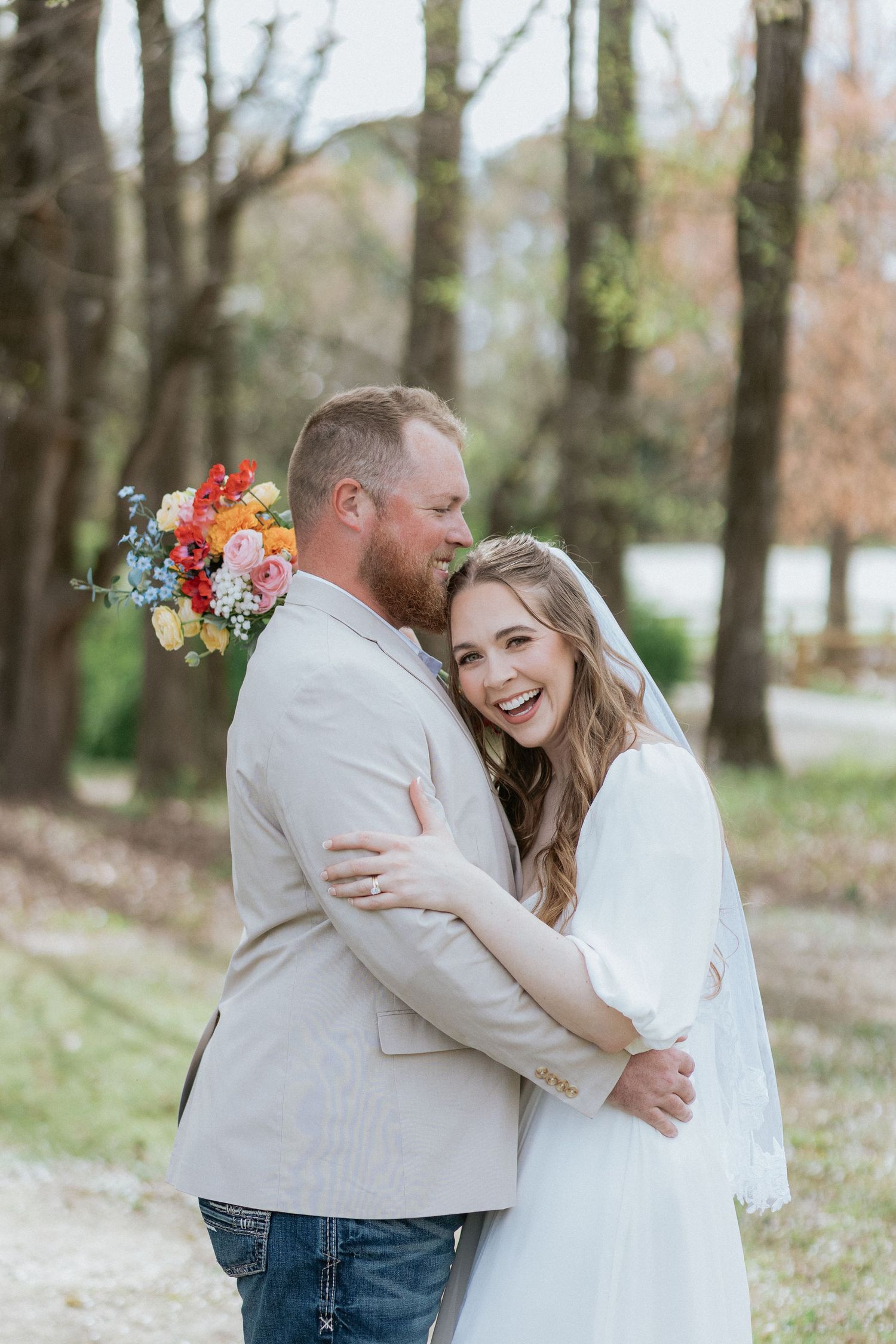 Couple embracing during a romantic elopment session in Auburn, Alabama with candid storytelling photography