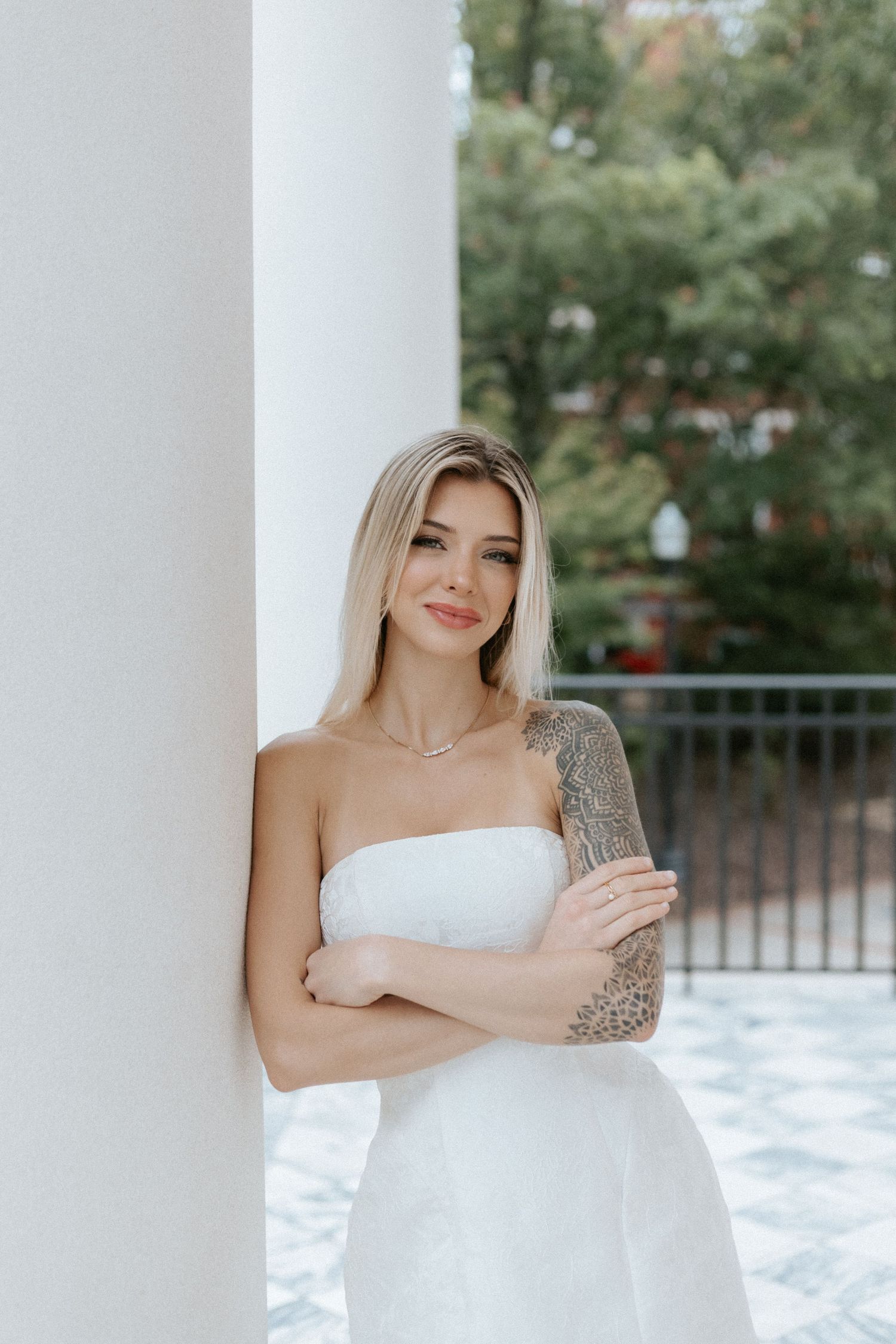 Graduate celebrating during a portrait session in Auburn, Alabama with a fun, candid and joyful vibe