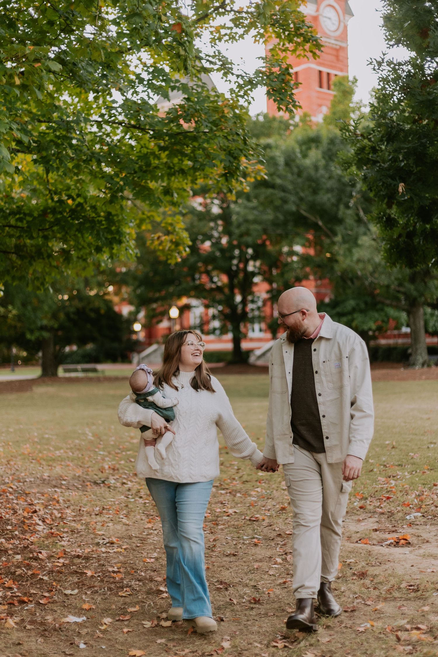Couple embracing during a romantic session in Auburn, Alabama ,at Auburn University with candid storytelling photography