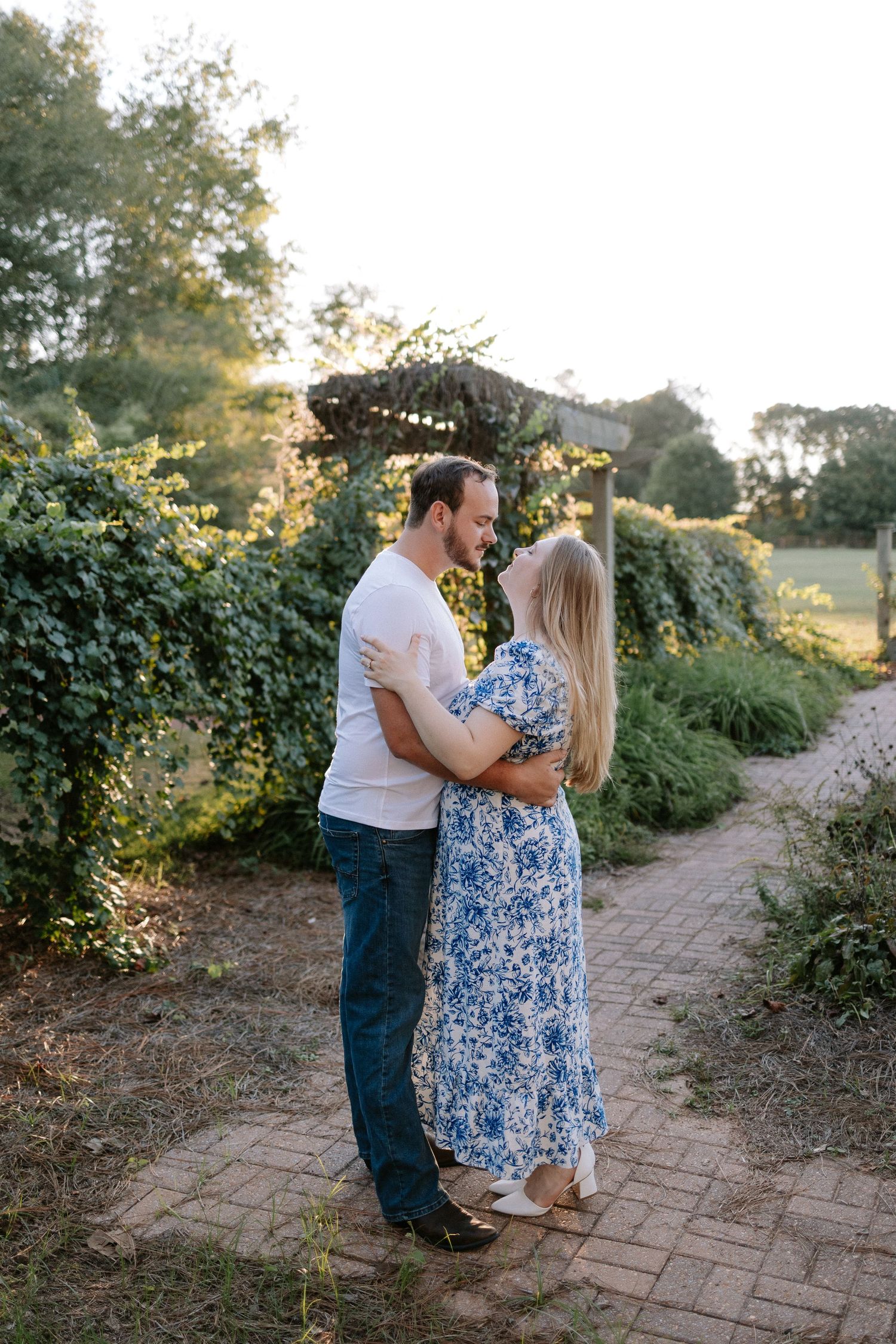 Couple embracing during a romantic elopment session in Auburn, Alabama at Kiesel Park with candid storytelling photography