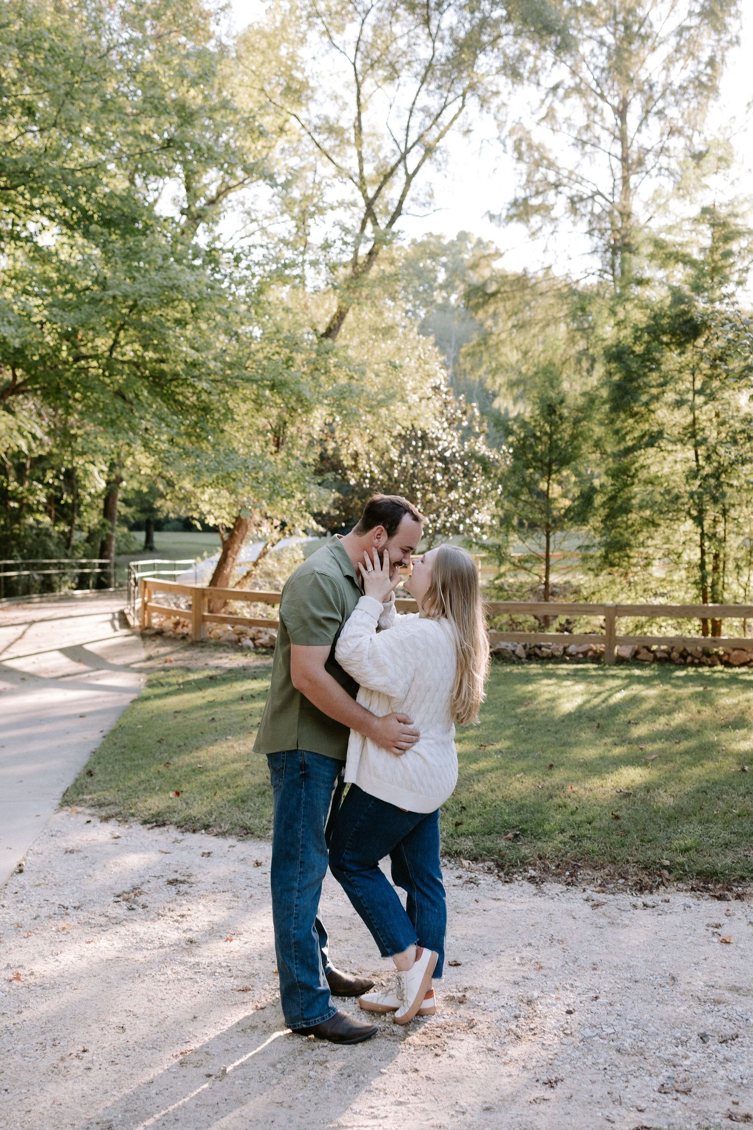 Couple embracing during a romantic elopment session in Auburn, Alabama at Kiesel Park with candid storytelling photography