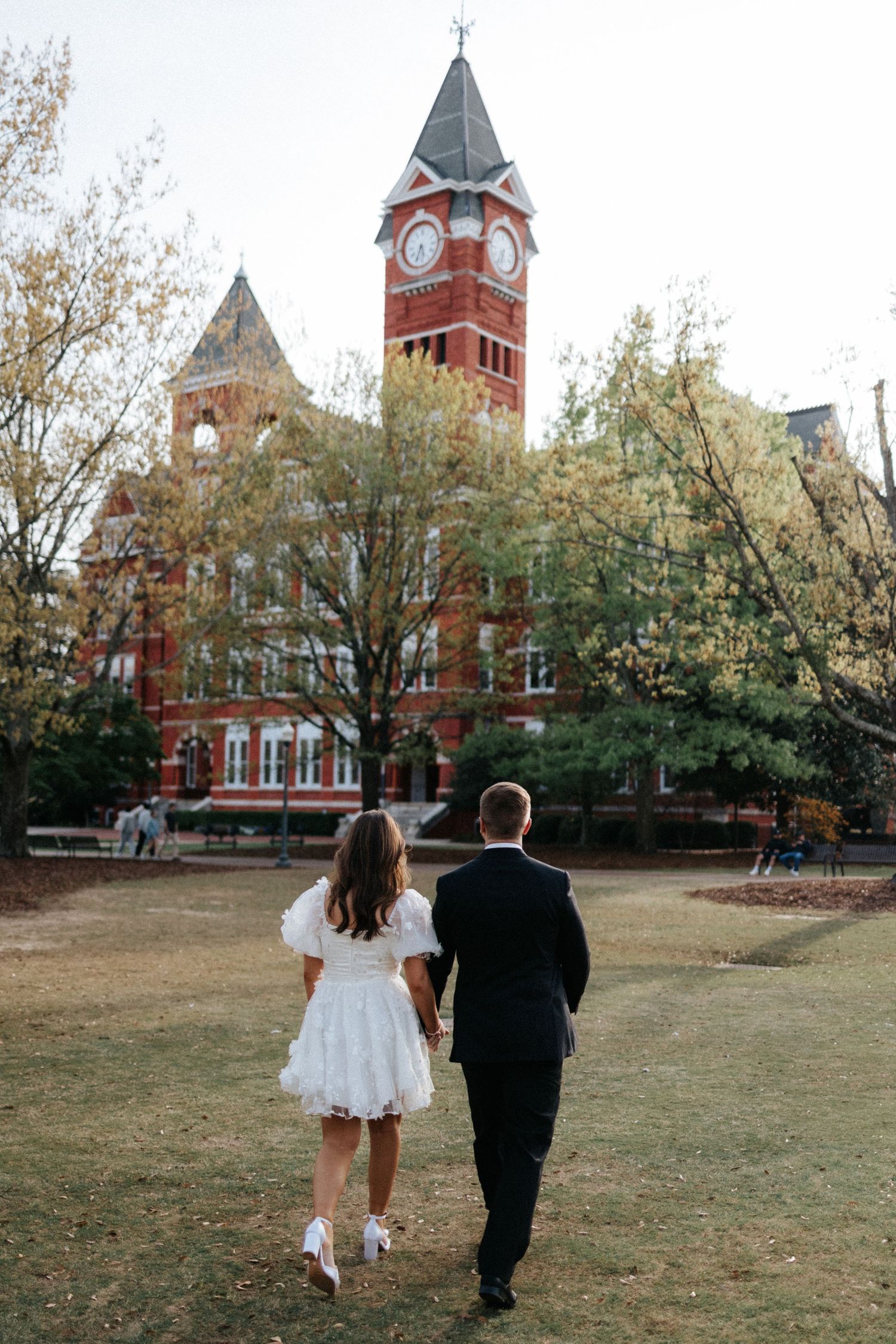Engagement session in Auburn Univeristy featuring a couple in a romantic, natural setting