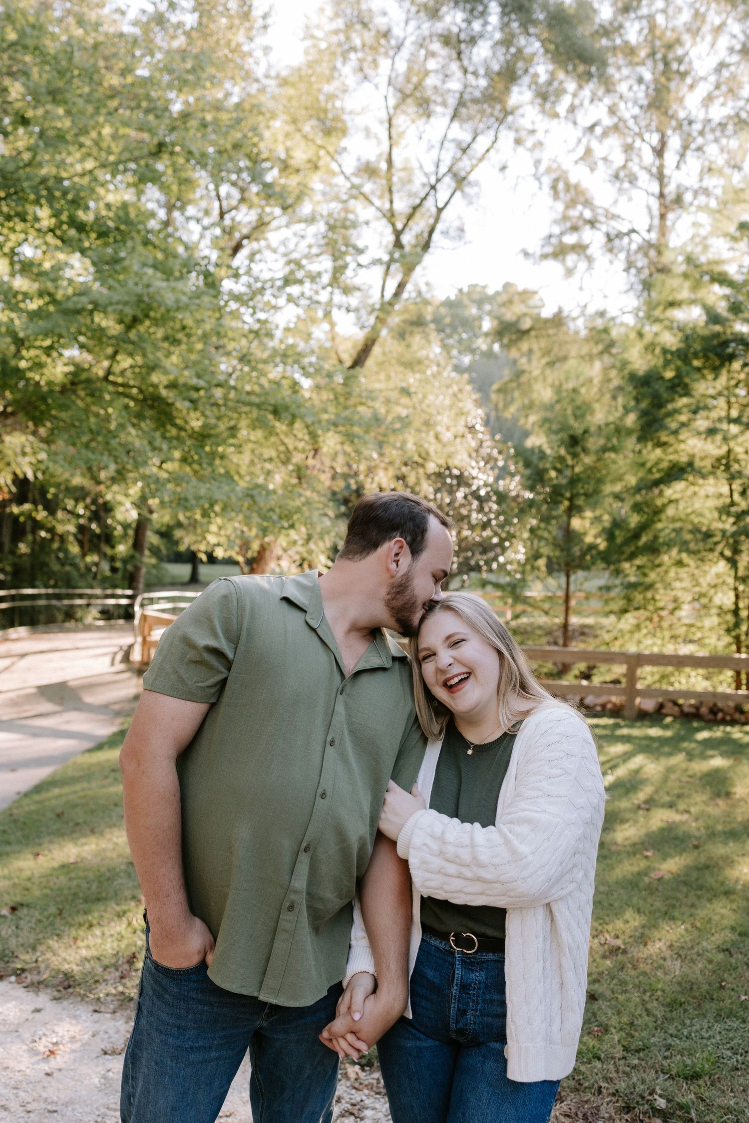 Couple embracing during a romantic elopment session in Auburn, Alabama at Kiesel Park with candid storytelling photography