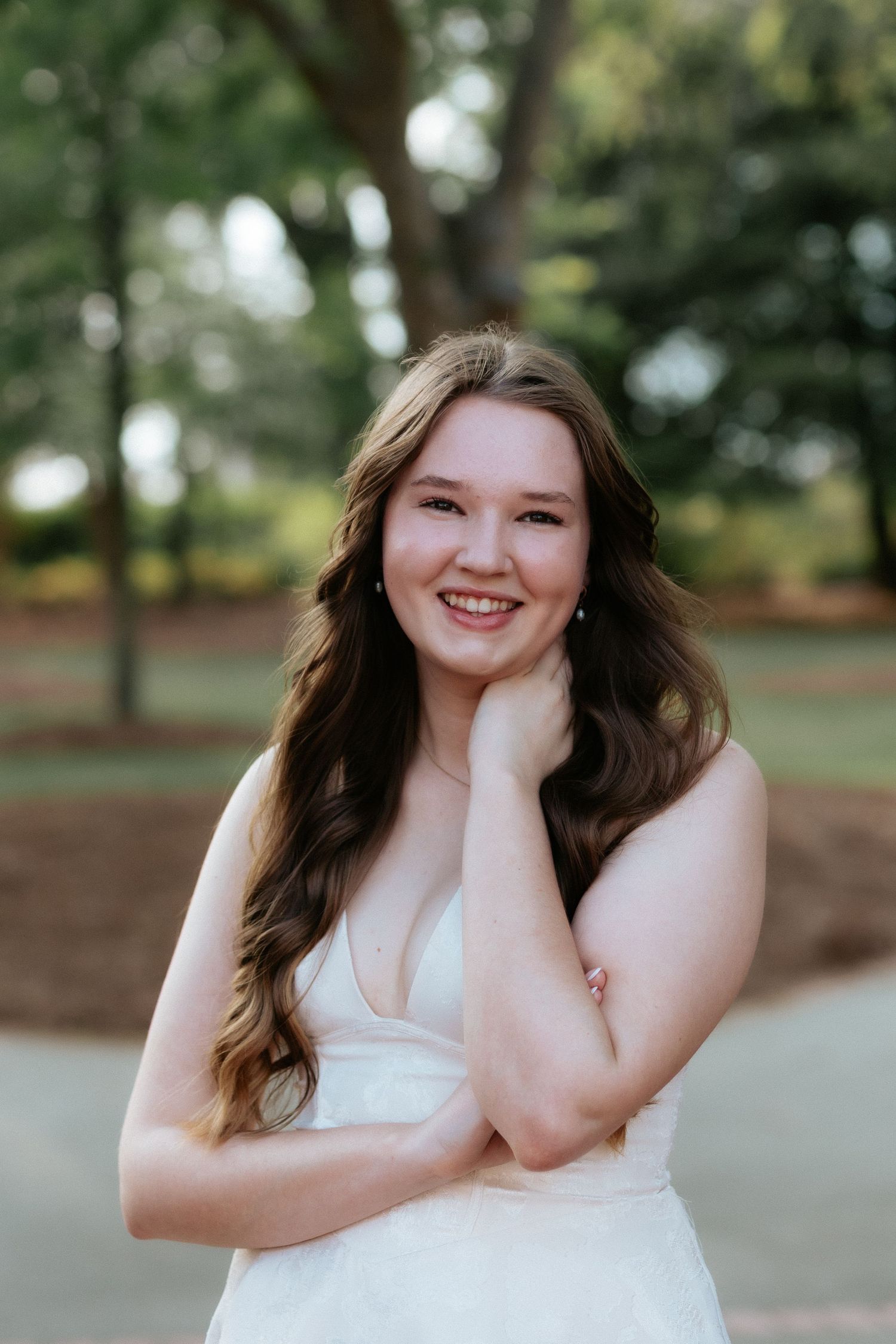 Graduate celebrating during a portrait session in Auburn, Alabama with a fun, candid and joyful vibe