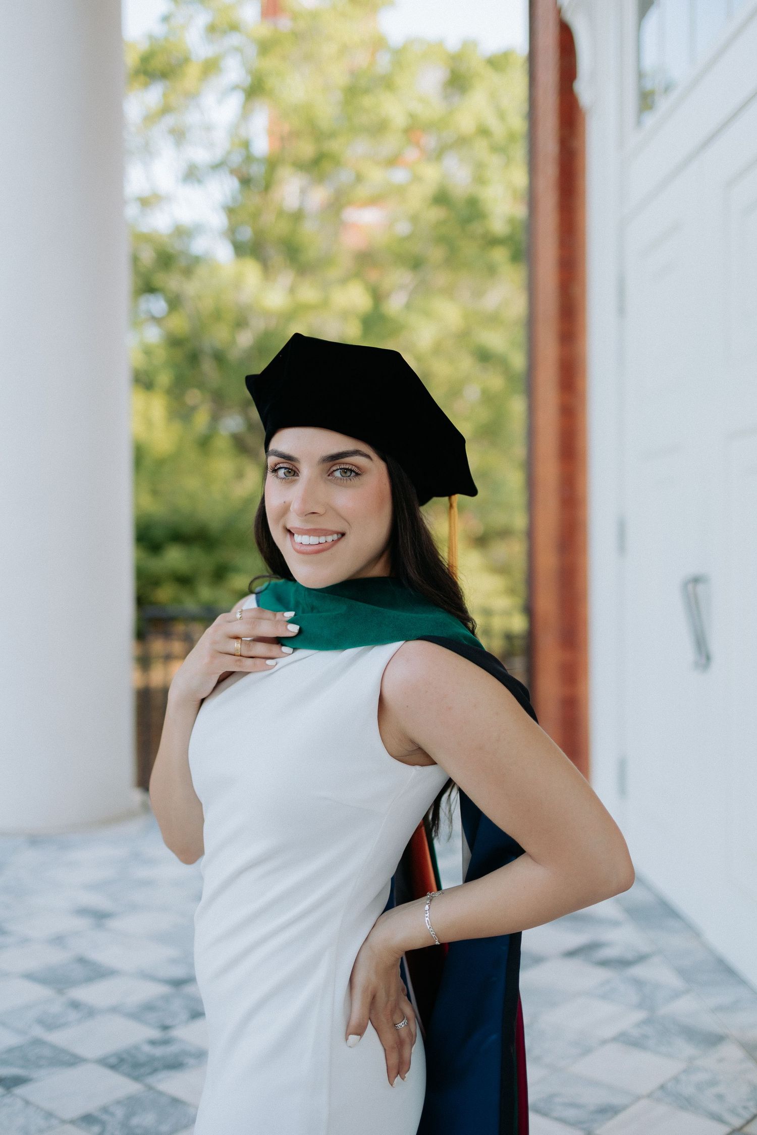 Graduate celebrating during a portrait session in Auburn, Alabama with a fun, candid and joyful vibe