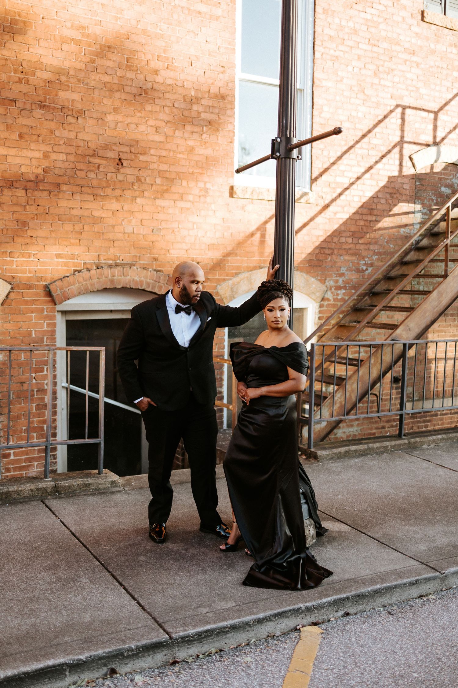 Couple embracing during a romantic elopement session in Opelika, Alabama with candid storytelling photography