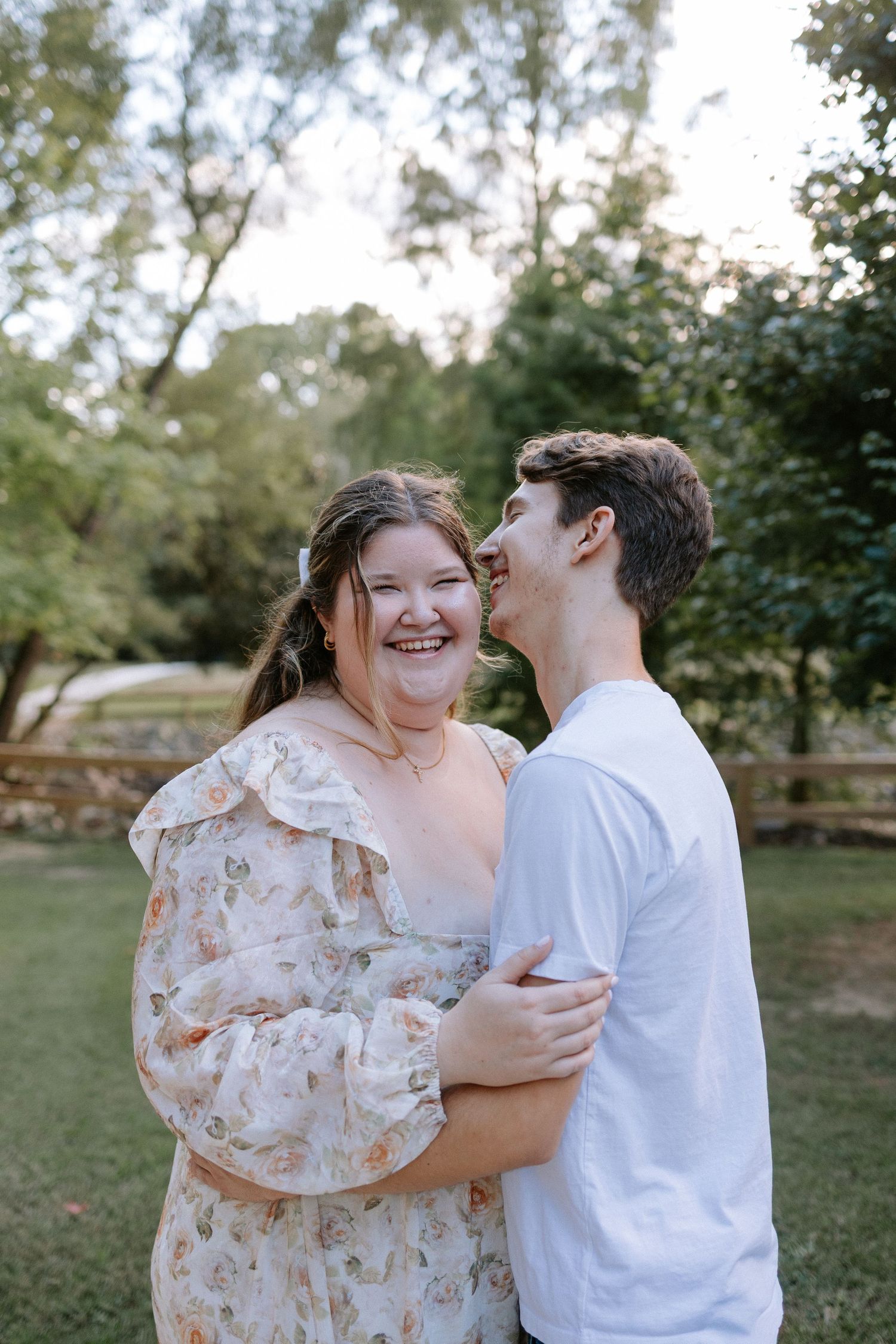 Couple embracing during a romantic elopment session in Auburn, Alabama at Kiesel Park with candid storytelling photography