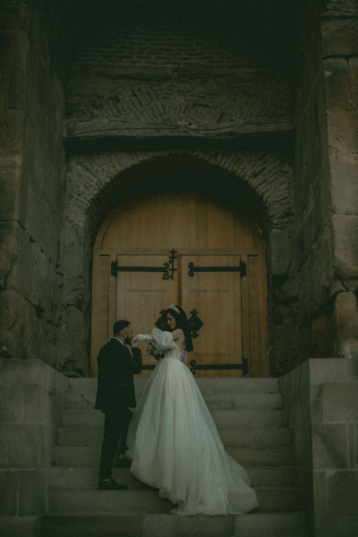 Whimsical wedding portrait with flowing dress and soft tones, evoking a romantic fairytale aesthetic