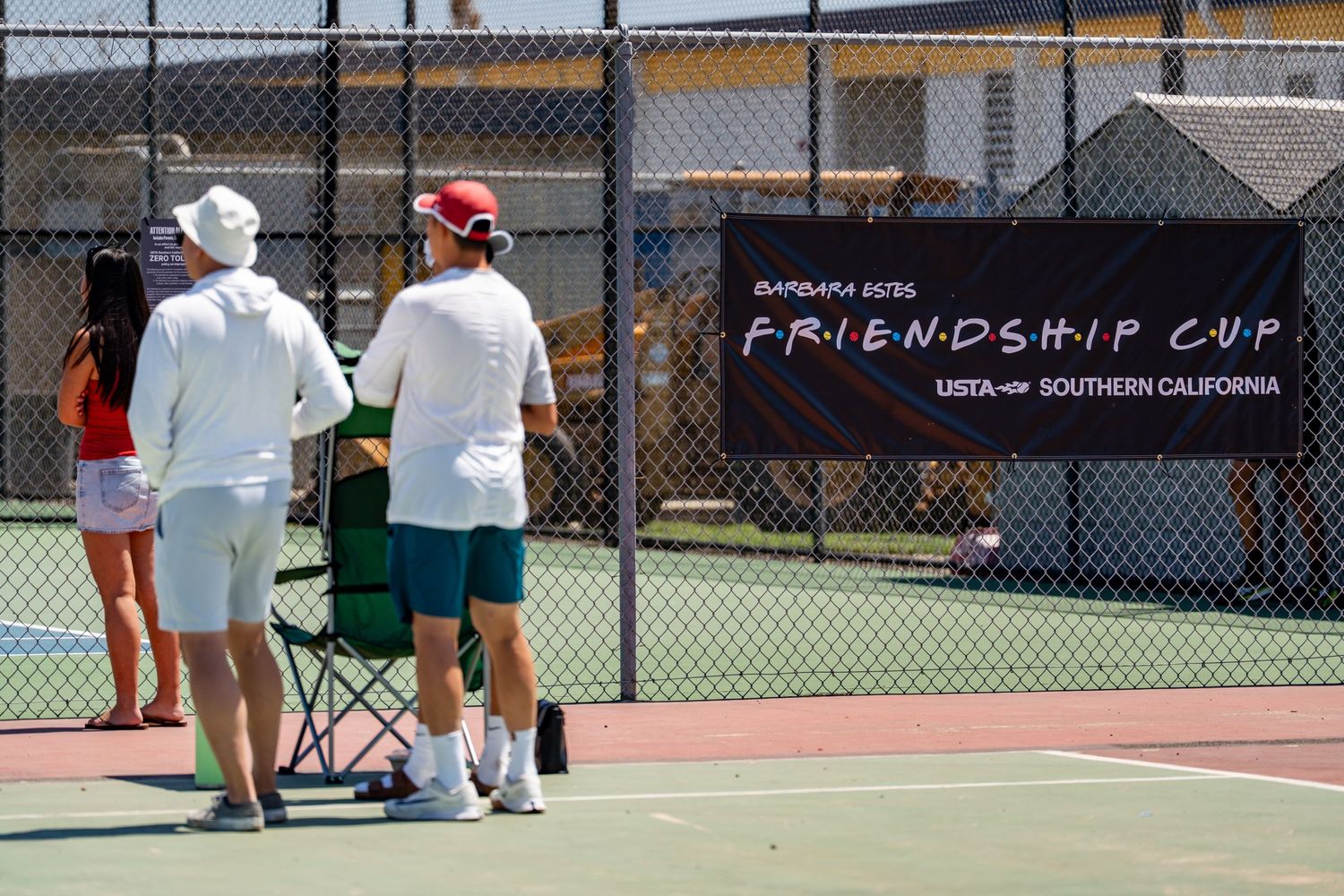 Players and coaches gather at the Barbara Bode Friendship Cup USTA Southern California outdoor tennis tournament.
