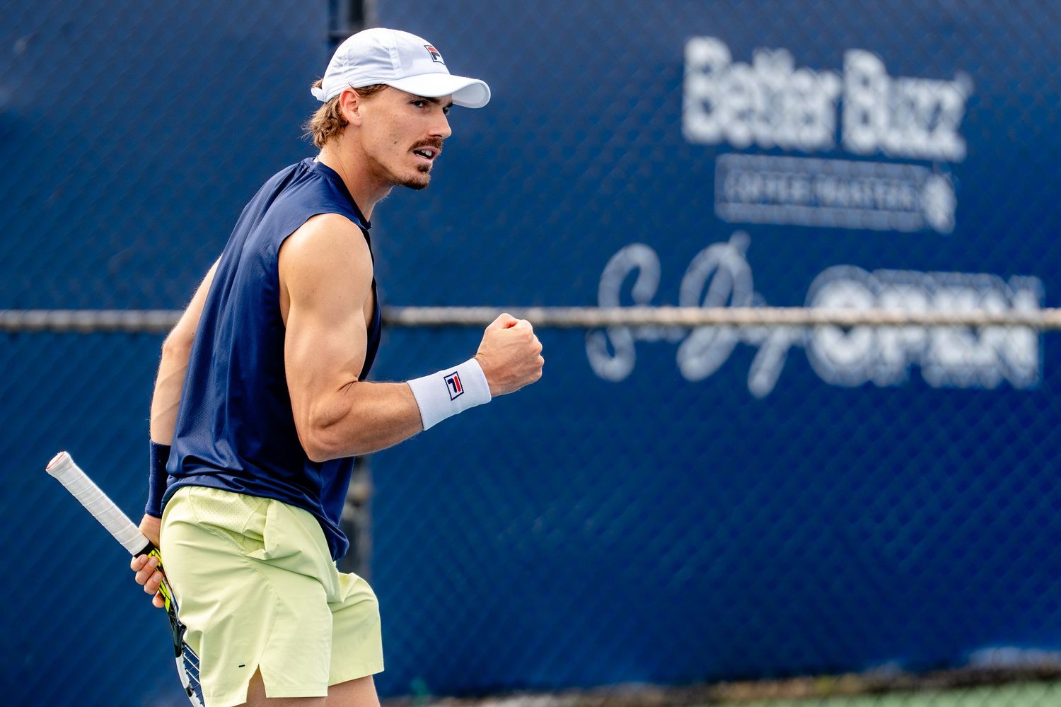 Male tennis player celebrates with fist pump at Better Buzz San Diego Open tennis tournament.