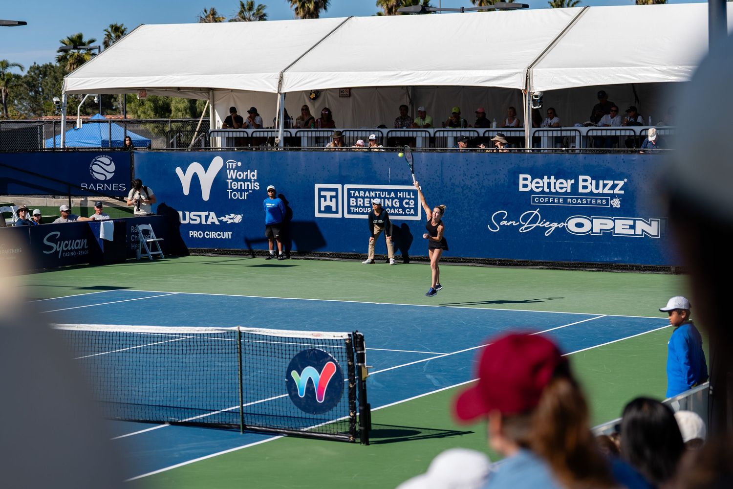 Wide view of a tennis match in progress at the Better Buzz Coffee Roasters San Diego Open tournament.