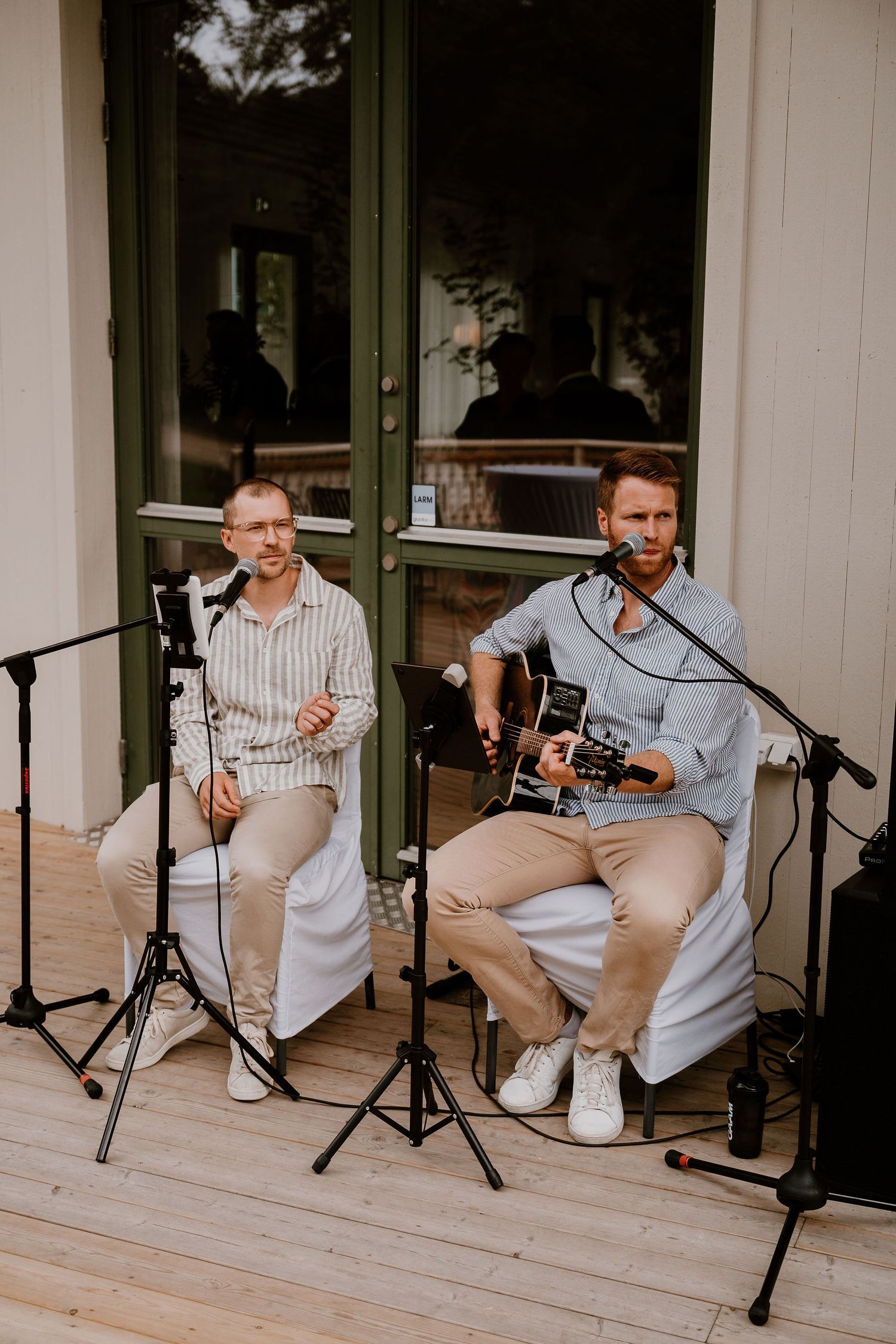 A series of four photos showing musicians performing while seated on a white porch with recording equipment.