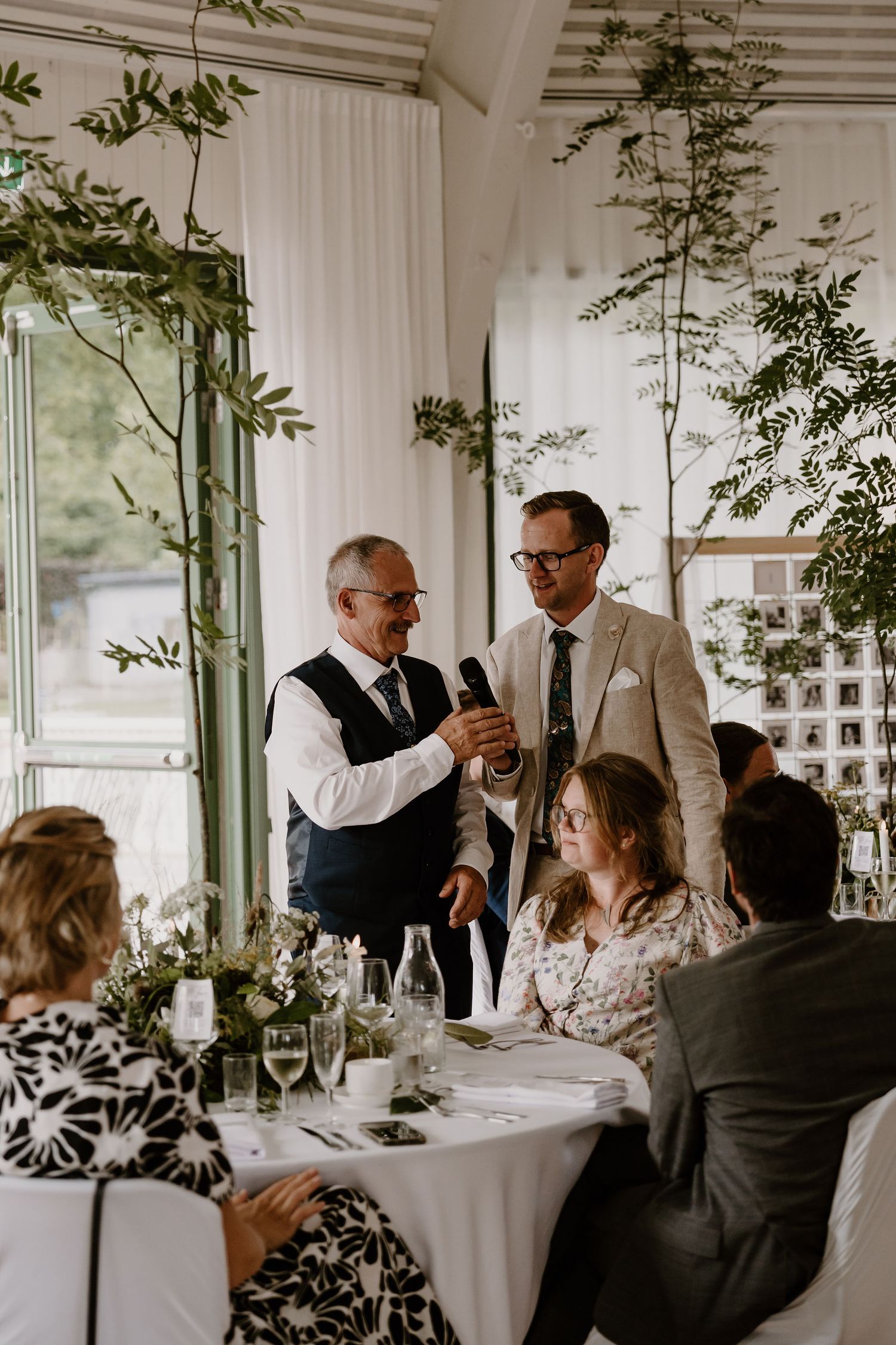 A split view of formal table conversations during a wedding reception in a light-filled room with potted plants.