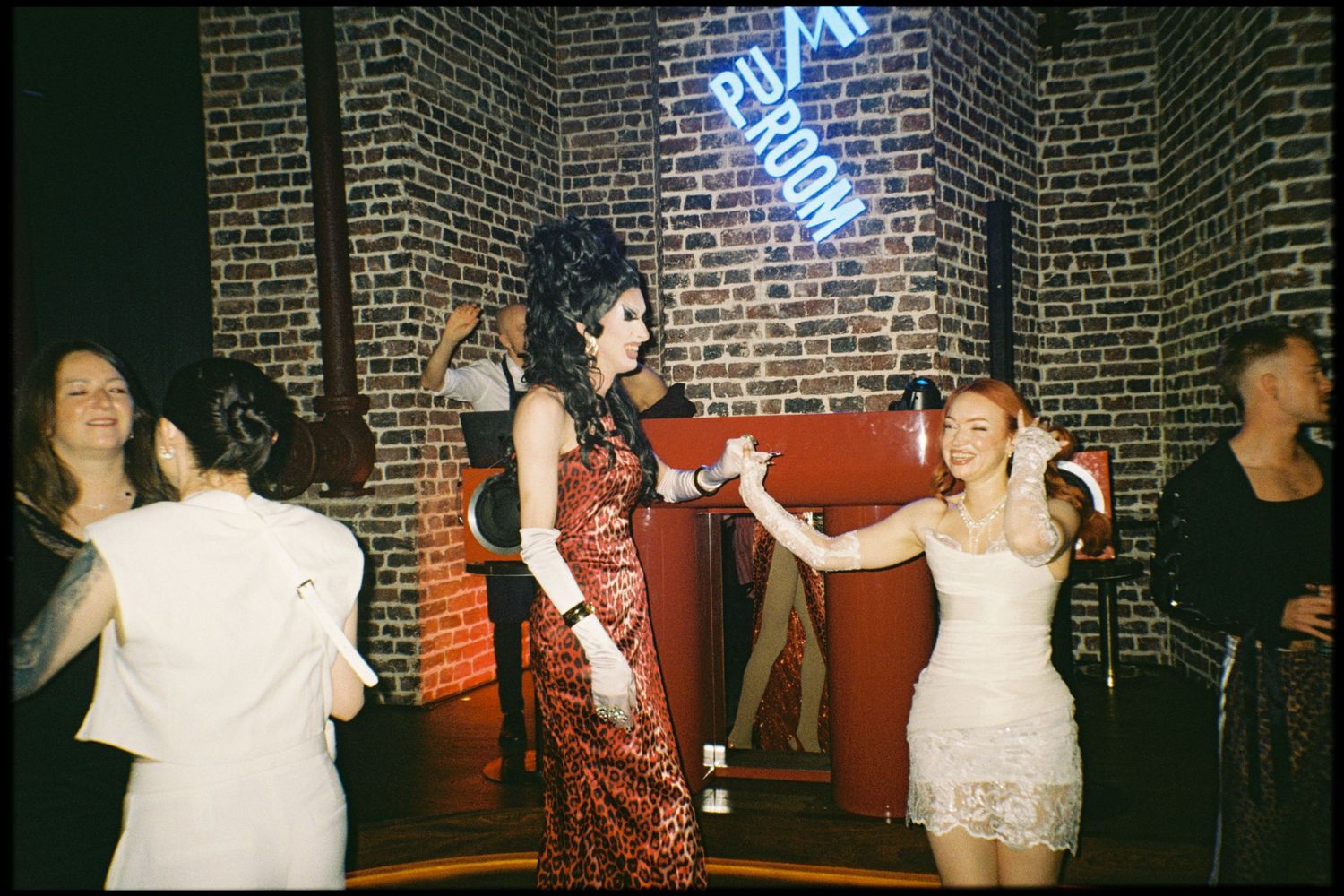 A series of vintage-style flash photographs showing people dancing and socializing at a dimly lit brick-walled nightclub.