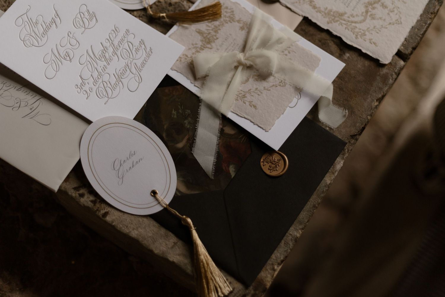Several handwritten notes and papers scattered across a dark wooden surface in vintage style lighting.